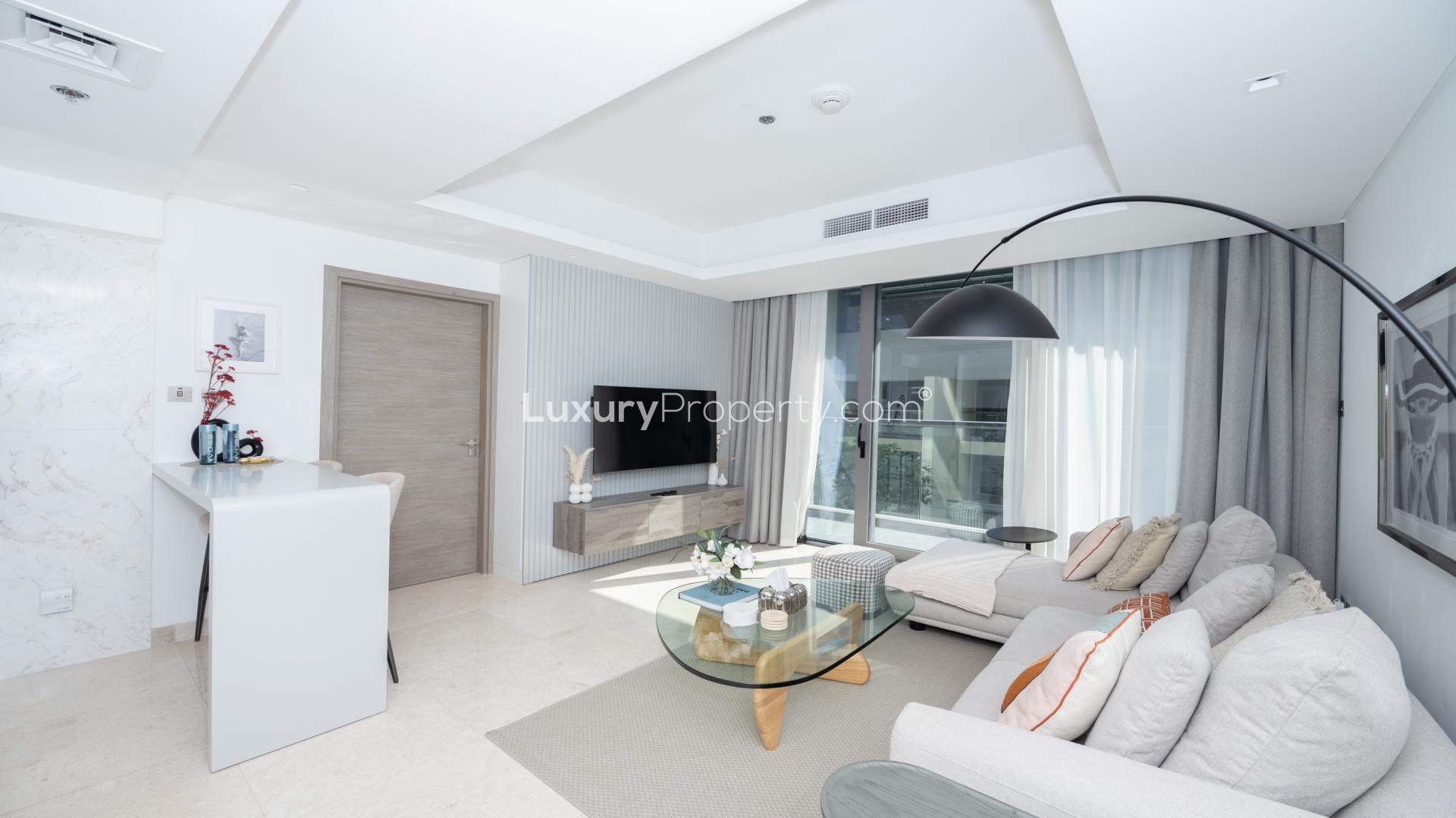Modern living area in The Sterling East apartment, Business Bay, with stylish decor and kitchen