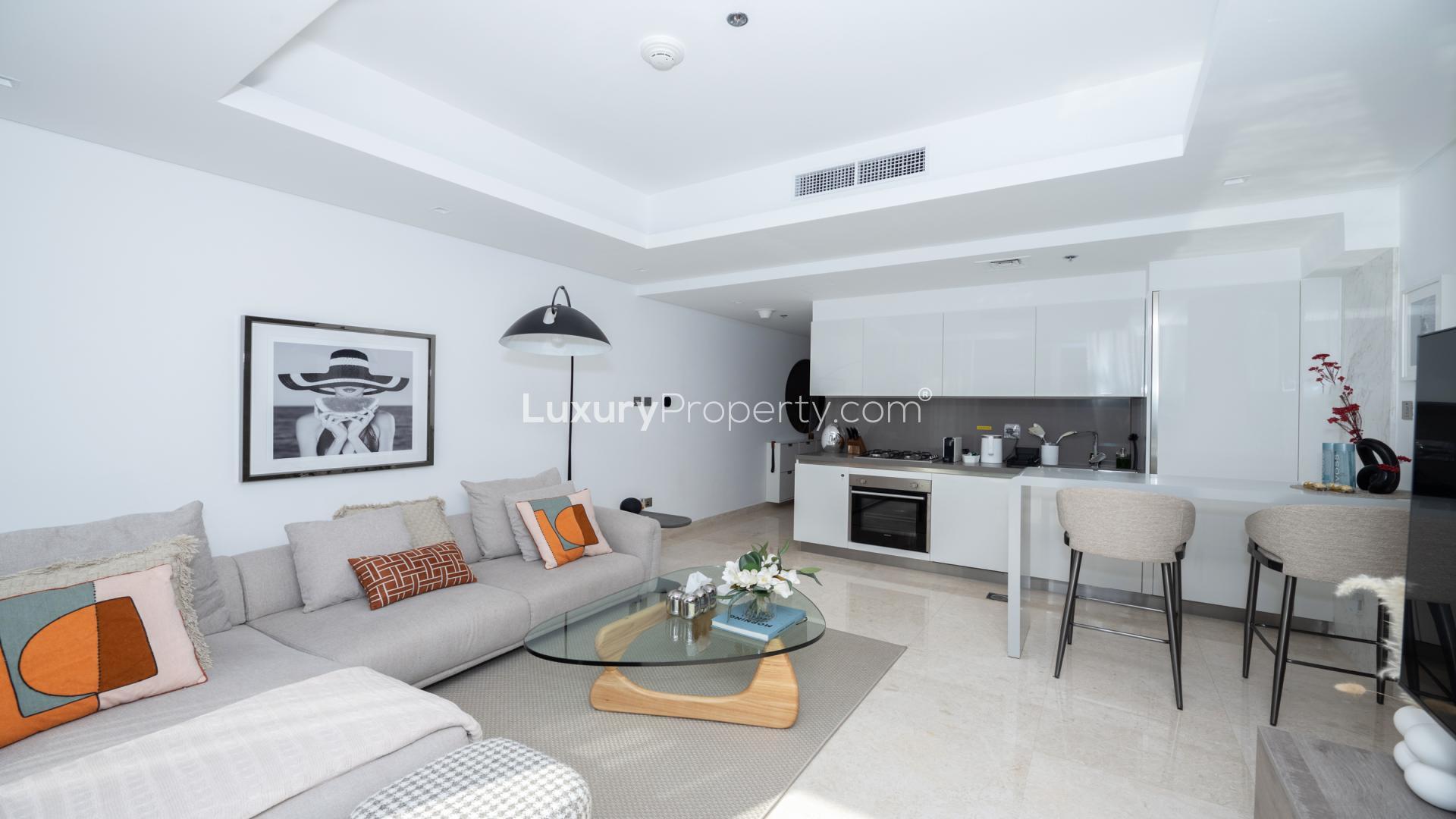 Spacious living room in The Sterling East apartment, Business Bay, with modern decor and finishes
