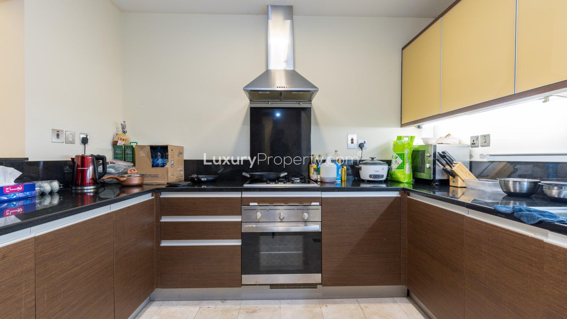 Luxury living room in Grandeur Residences apartment, Palm Jumeirah, with elegant decor and balcony view