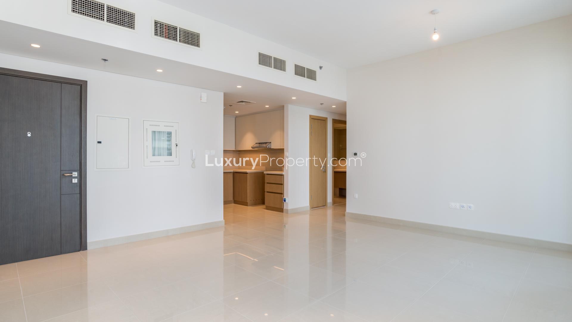 Empty living room with large windows in Tiara Residences apartment, Palm Jumeirah, Dubai