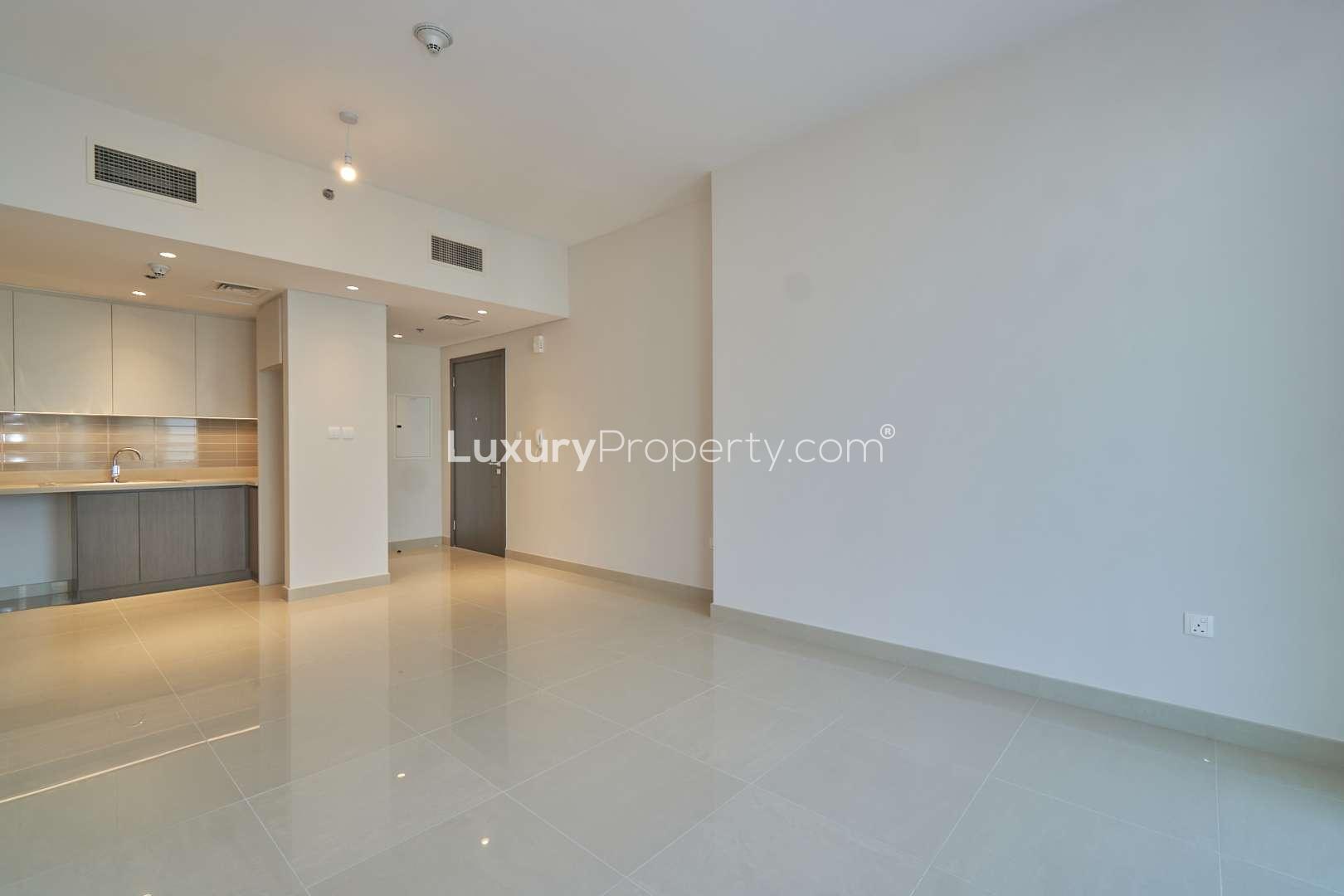 Spacious living area in Dubai Creek Harbour apartment for sale, modern interior, bright lighting