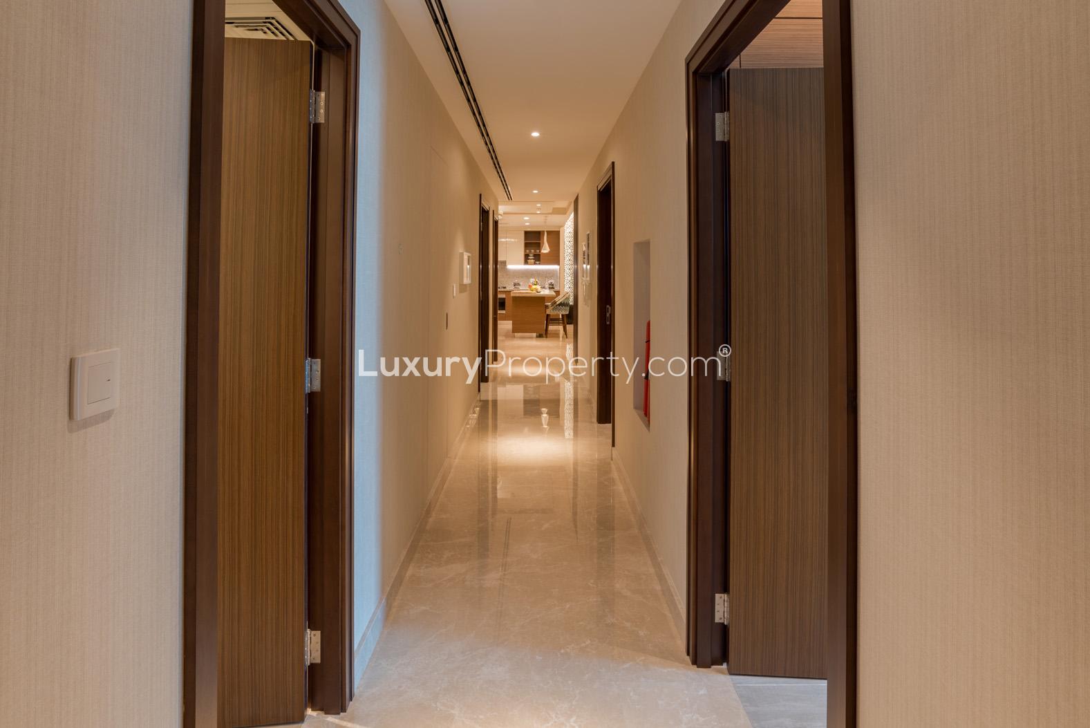 Hallway in luxurious 1-bedroom apartment, Imperial Avenue, Downtown Dubai, marble flooring, elegant design