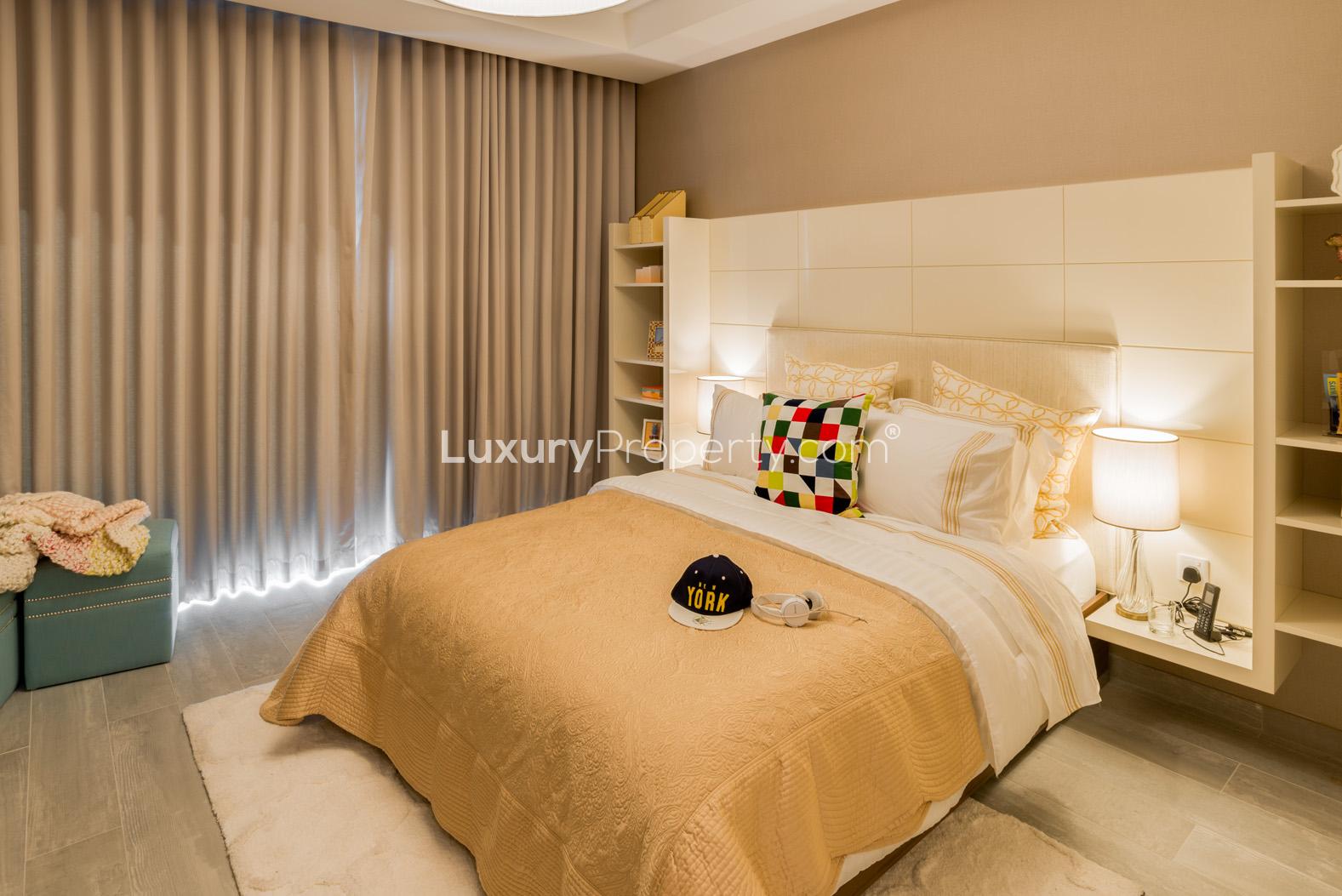 "Imperial Avenue luxury apartment building exterior, Downtown Dubai skyline background.",Luxurious bedroom in 1-bed apartment, Imperial Avenue, Downtown Dubai, with elegant decor