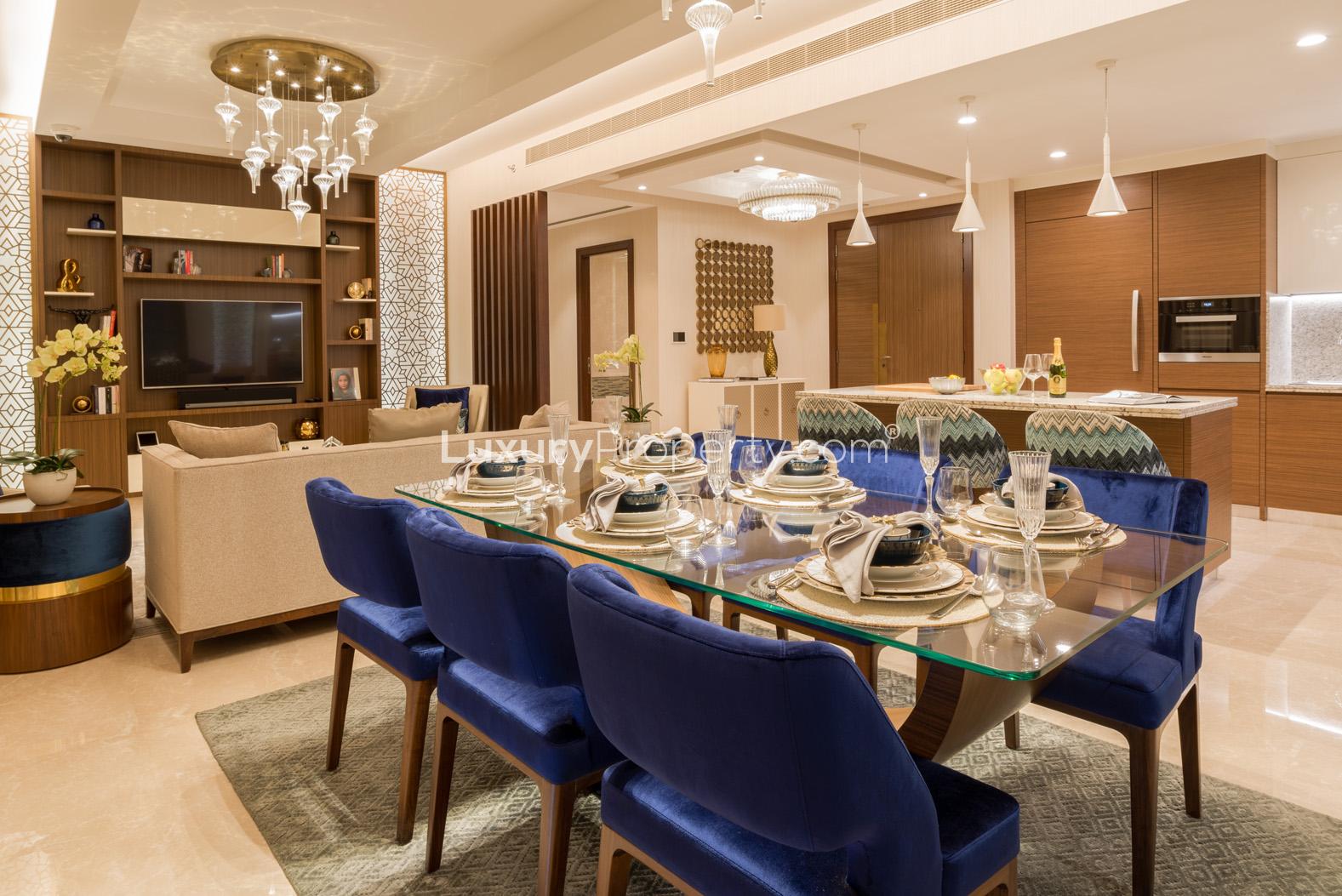 Luxury apartment balcony view with greenery, gym, and skyline in Imperial Avenue, Downtown Dubai