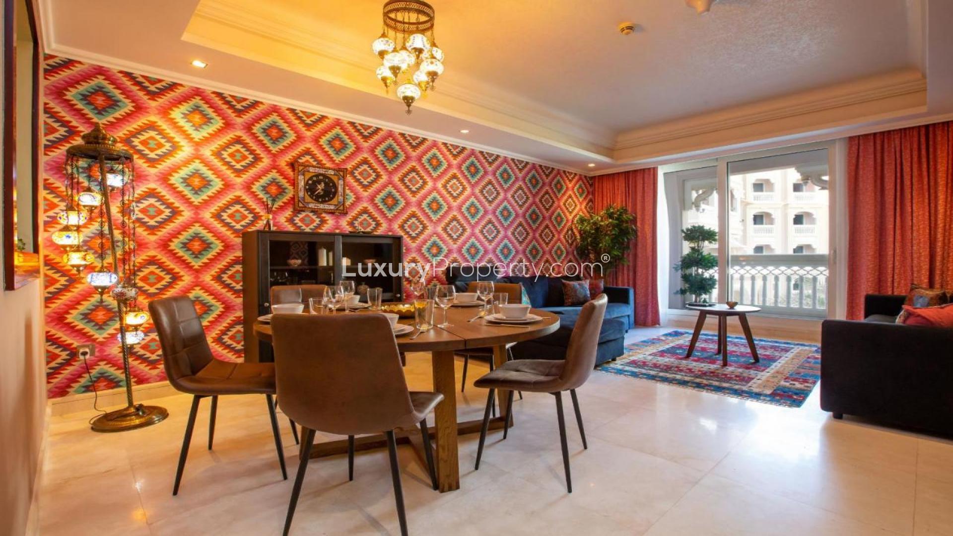 Palm Jumeirah apartment view with lush greenery and ocean backdrop, Grandeur Residences
