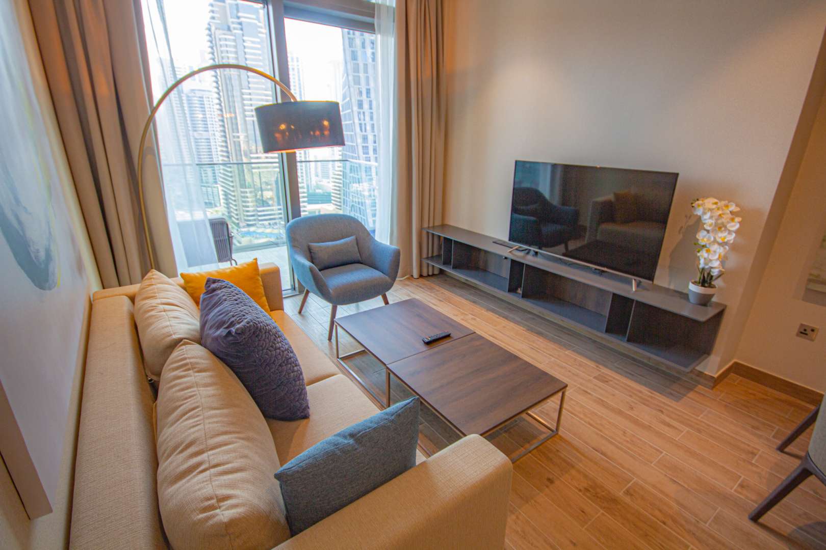 Modern living room in Marina Gate apartment, Dubai Marina, with stylish decor and seating area