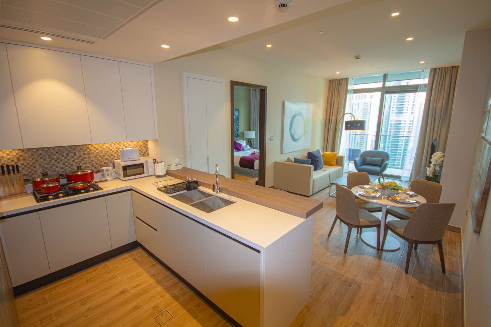 Modern living room in 1-bedroom Marina Gate apartment, featuring marina views and stylish decor
