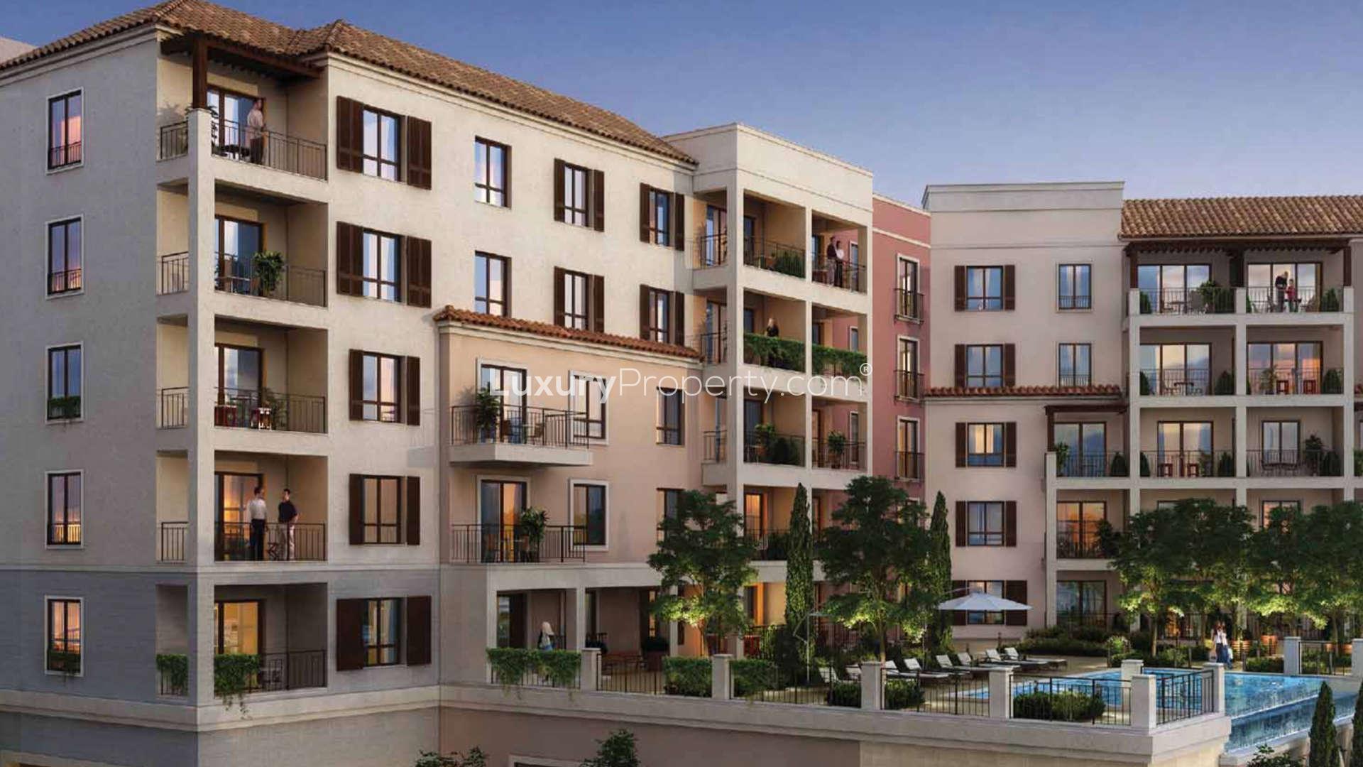 Elegant La Mer apartment building with balconies, lush landscaping, and vibrant community atmosphere