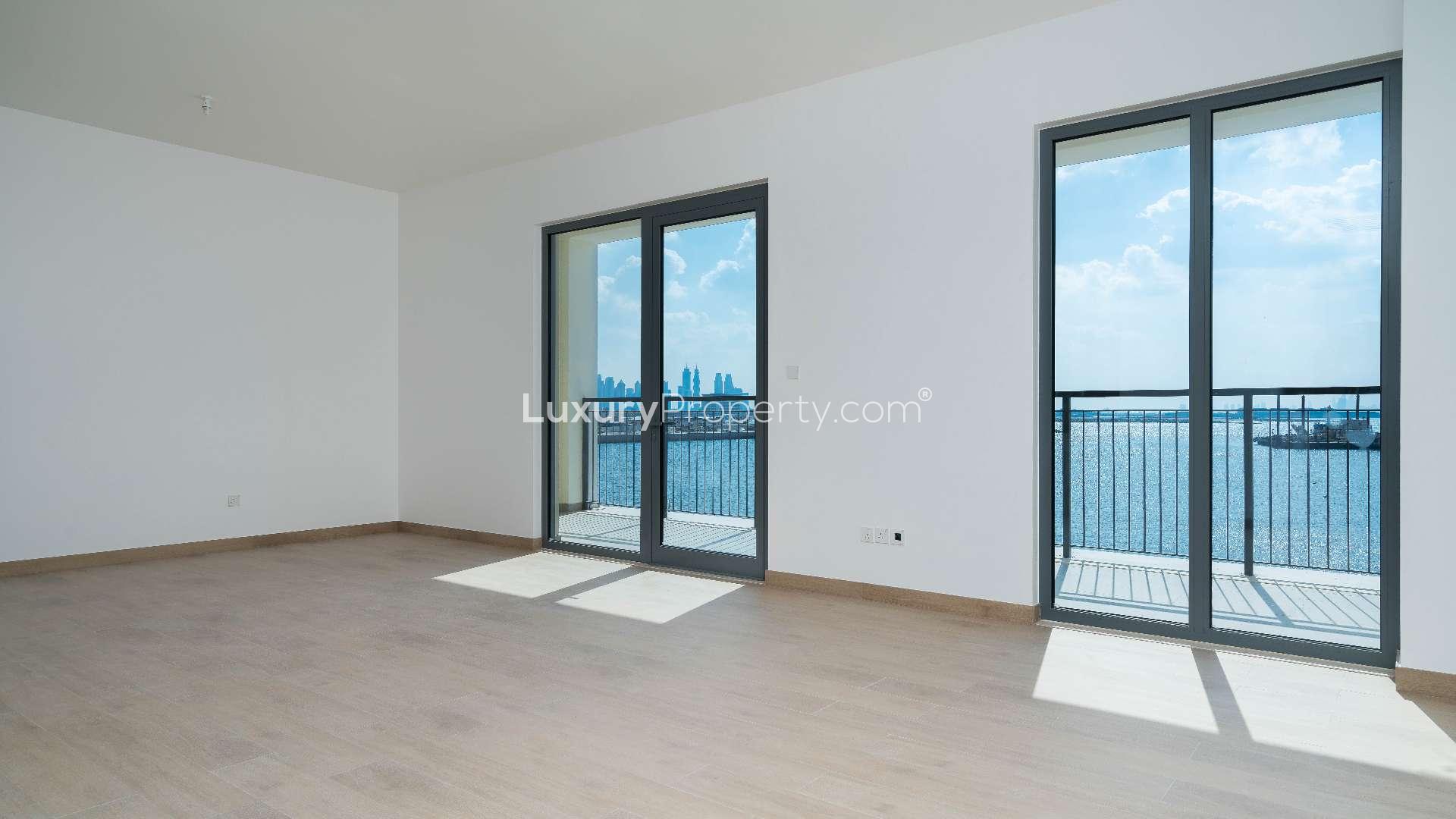 Spacious living area with modern kitchen in La Rive, Port De La Mer apartment