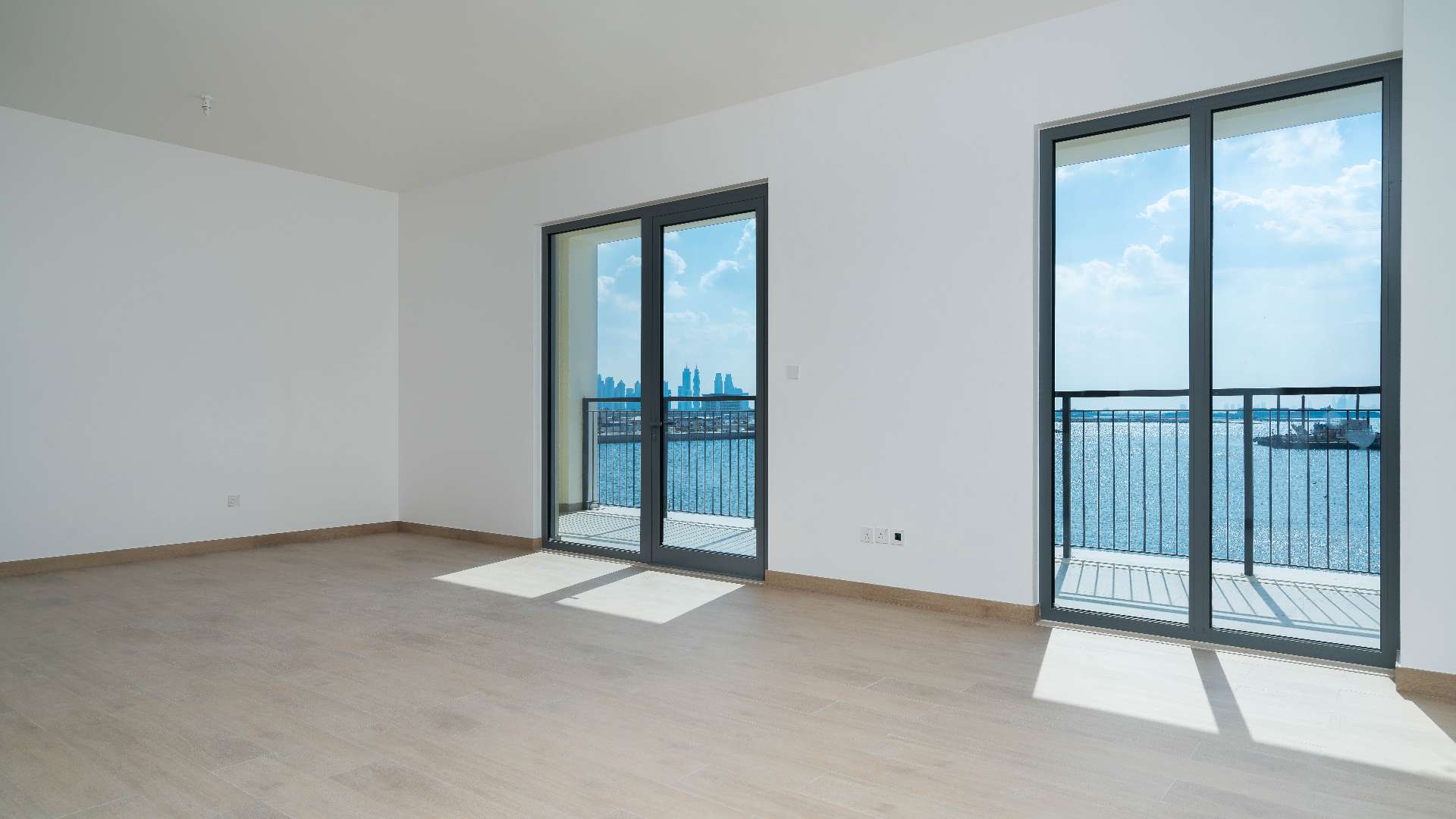 Spacious living area with modern kitchen in La Rive, Port De La Mer apartment