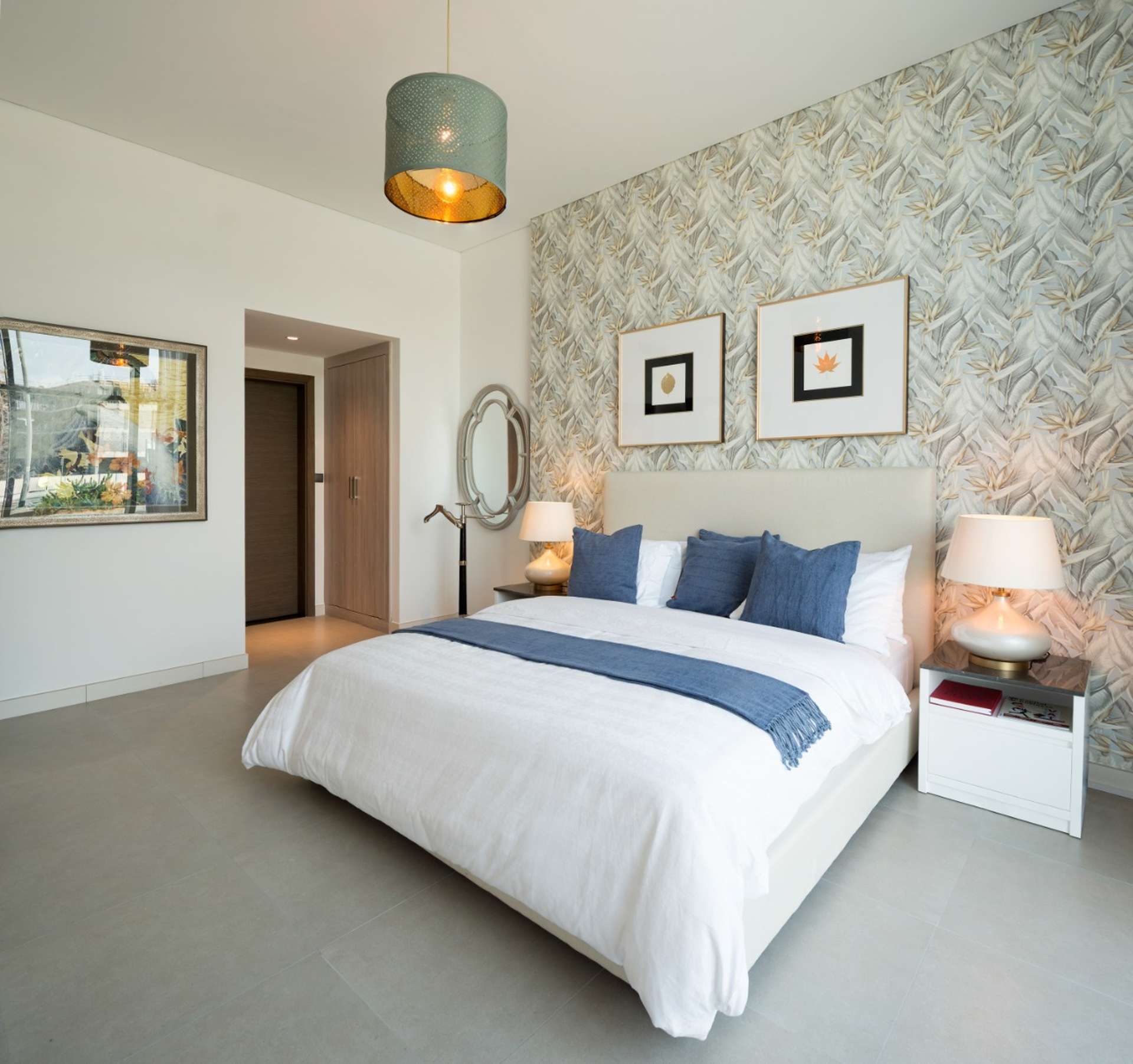 Elegant bedroom in La Riviera, JVC apartment with modern decor and ample natural light