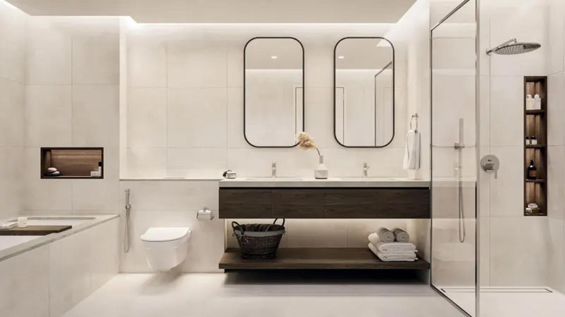 Modern kitchen in high-floor 1-bedroom apartment, Dubai Hills Estate, with stylish seating