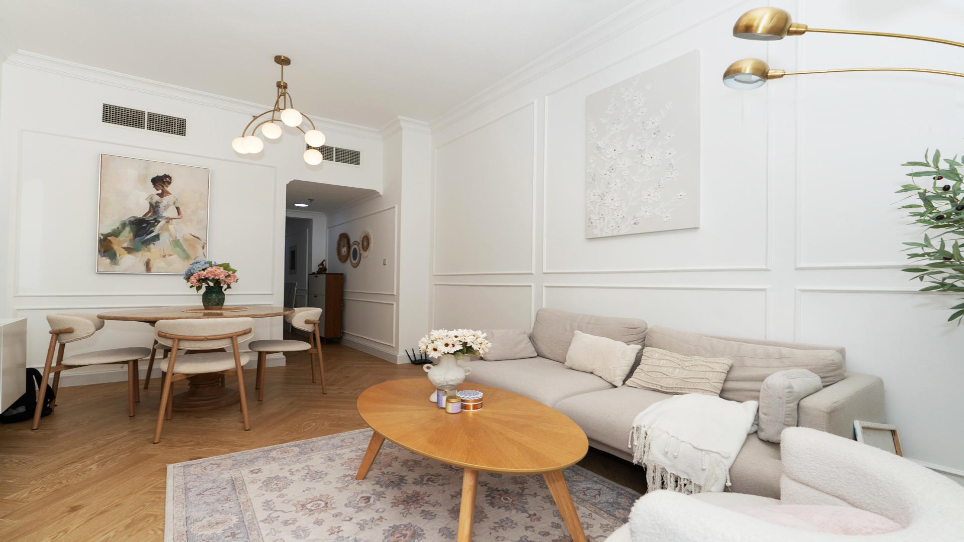 Modern living room in fully upgraded Al Barsha South apartment, featuring elegant decor and furniture