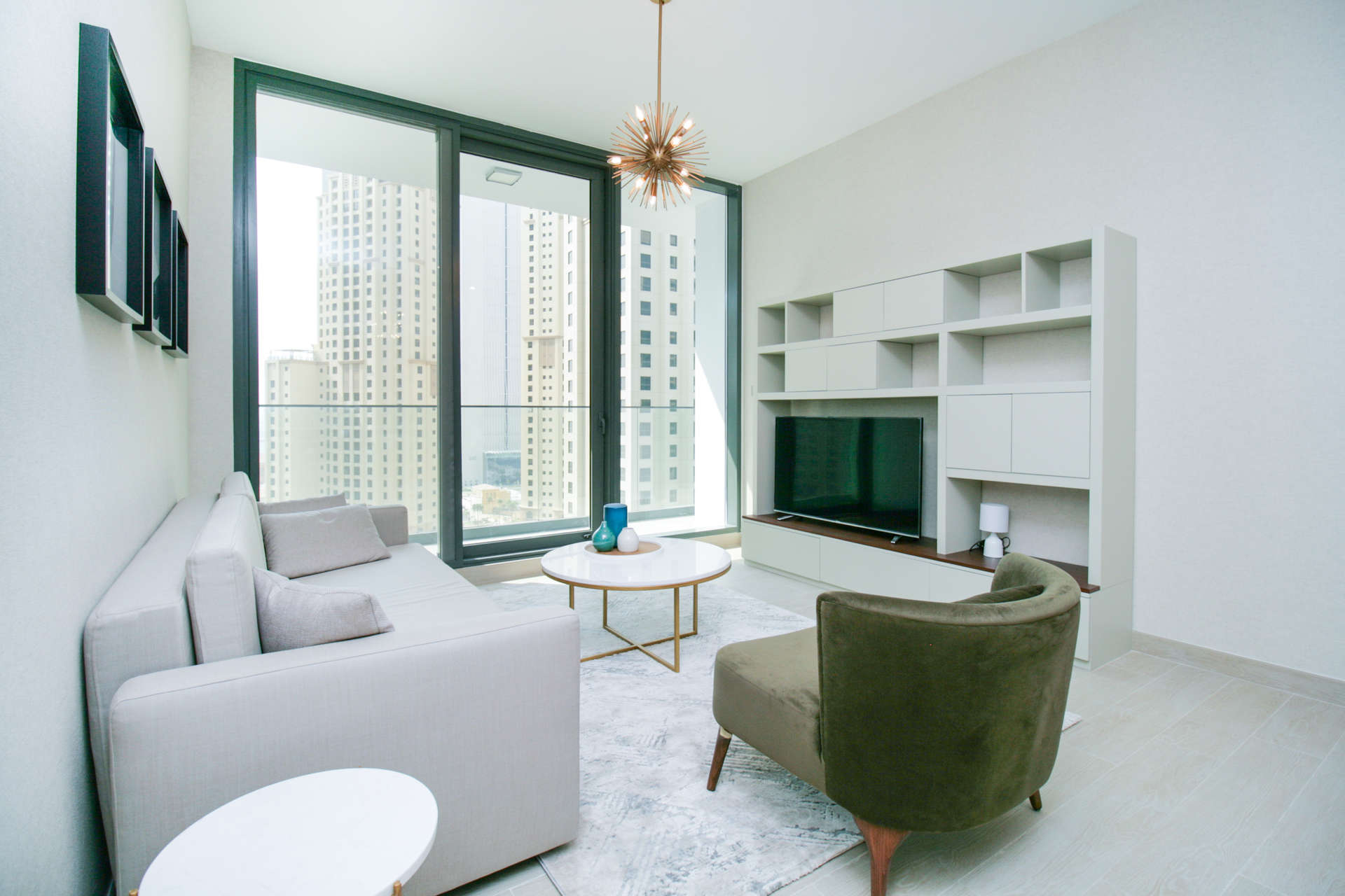 Modern living room in one-bed apartment, Dubai Marina waterfront view at LIV Residence