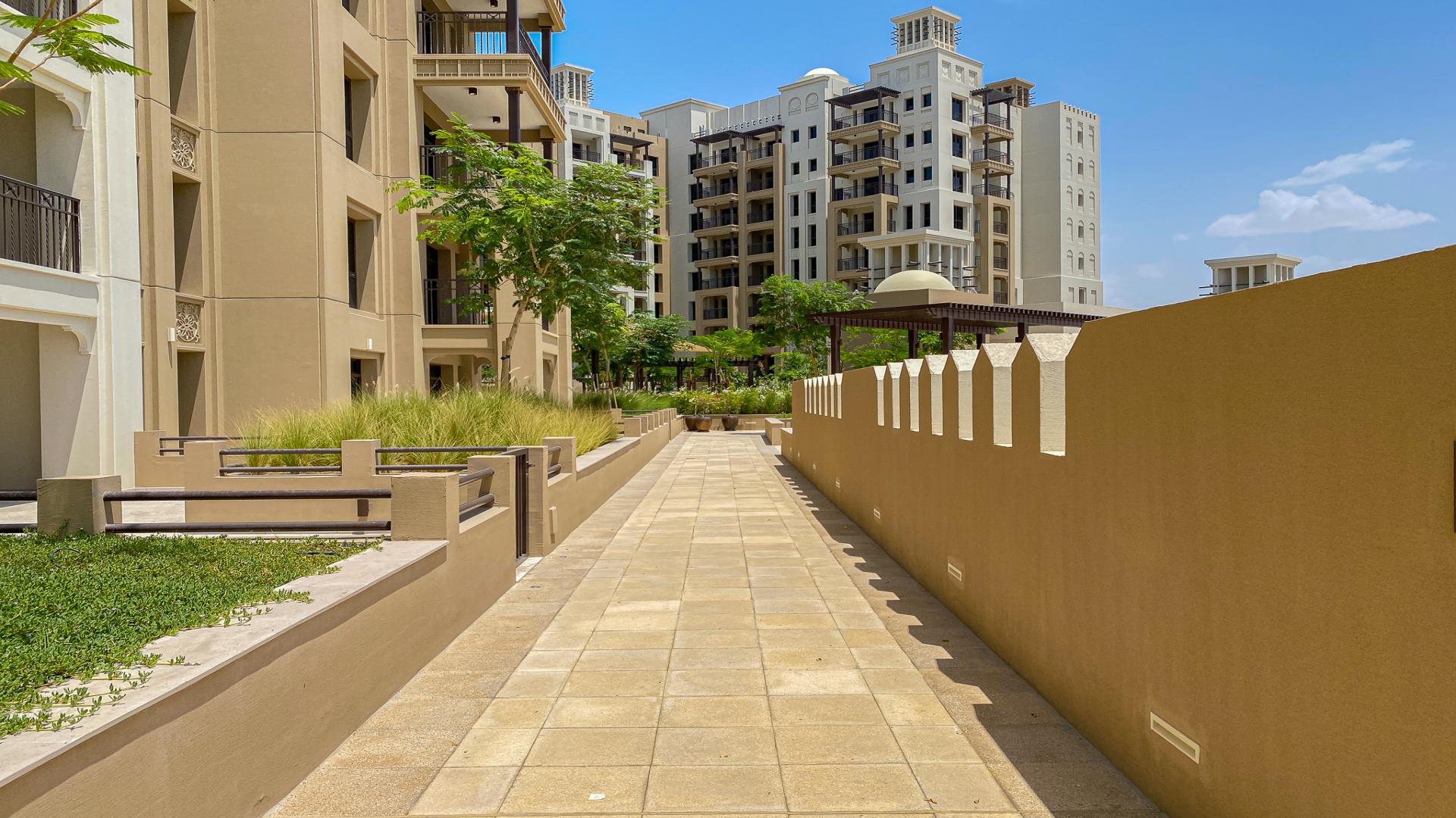 High-floor apartment exterior in Madinat Jumeirah Living, Umm Suqeim, lush greenery view