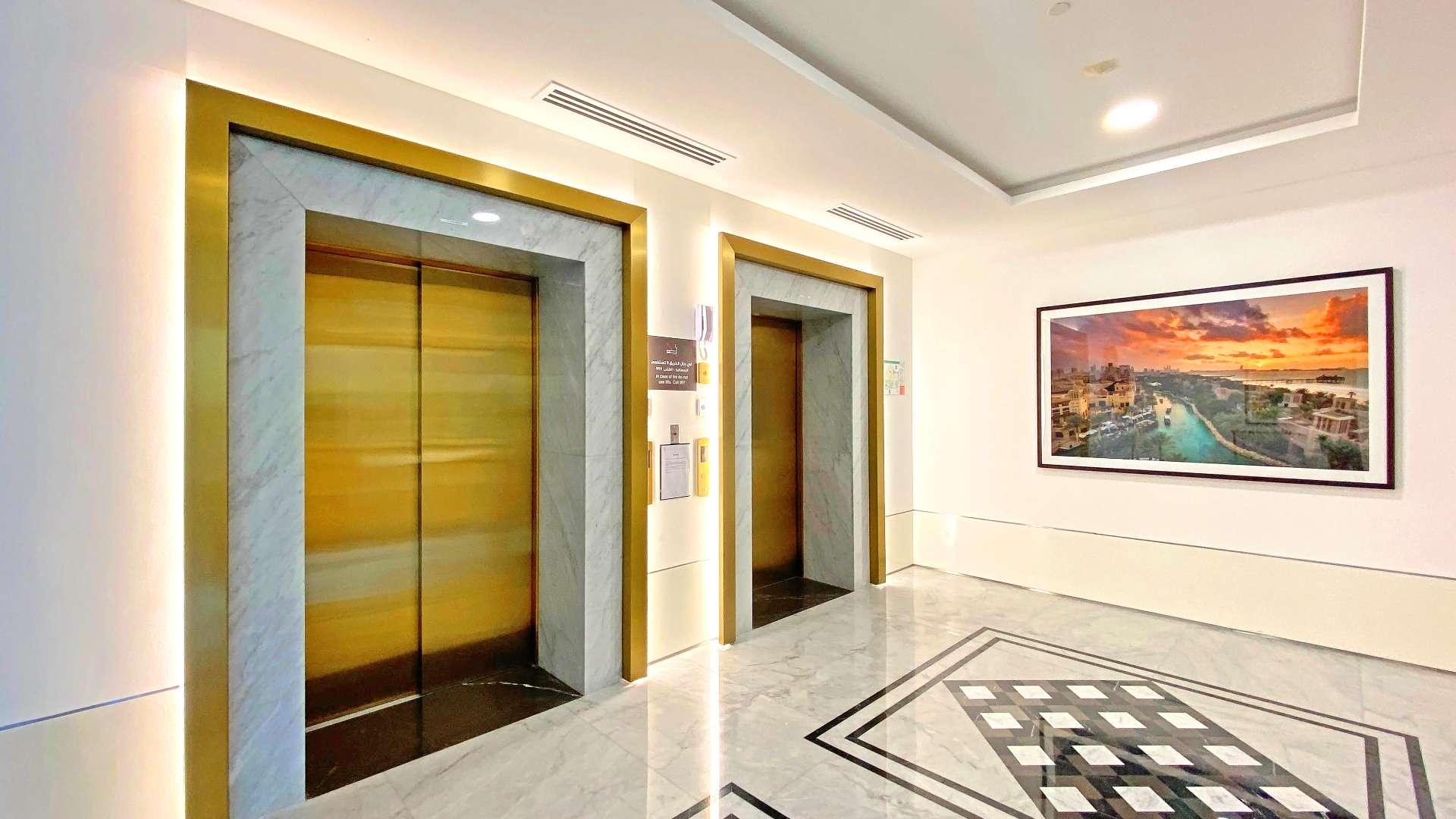 High-floor Madinat Jumeirah apartment exterior with walkway, Umm Suqeim, for sale