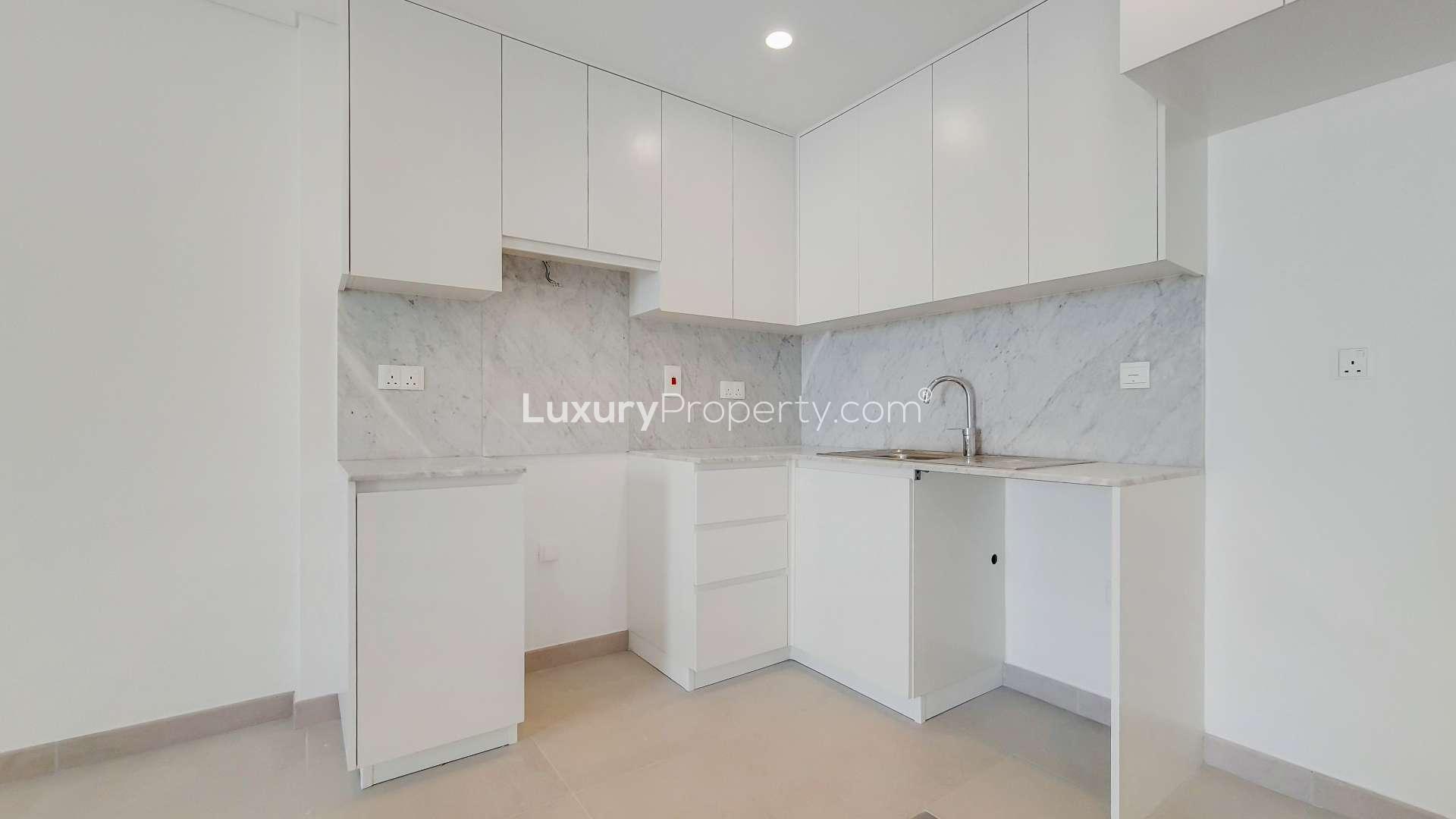 "Modern apartment building exterior in Madinat Jumeirah Living, Umm Suqeim, ready for sale.",Modern kitchen in 1-bedroom apartment, Madinat Jumeirah Living, Umm Suqeim, ready to move in