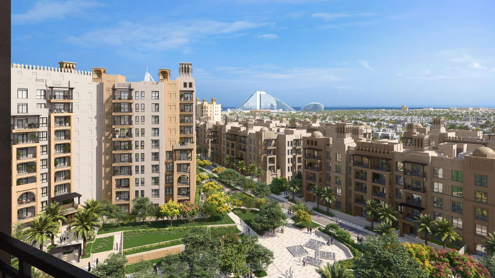 Alt text: "Stunning view of Madinat Jumeirah Living apartments in Umm Suqeim, Dubai for sale.",Modern apartment buildings in Madinat Jumeirah Living, Umm Suqeim, for sale