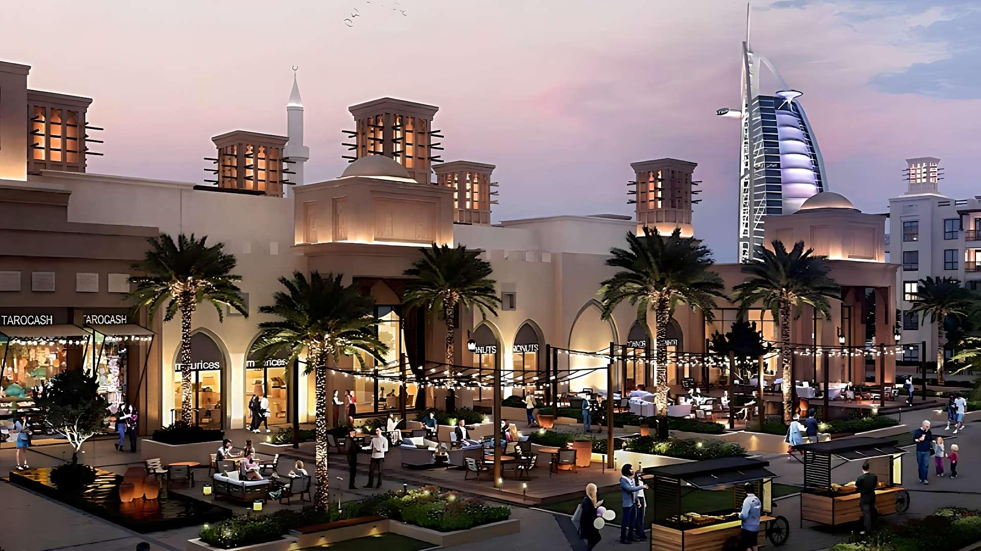 Contemporary bedroom in Madinat Jumeirah Living apartment, featuring modern decor and balcony view