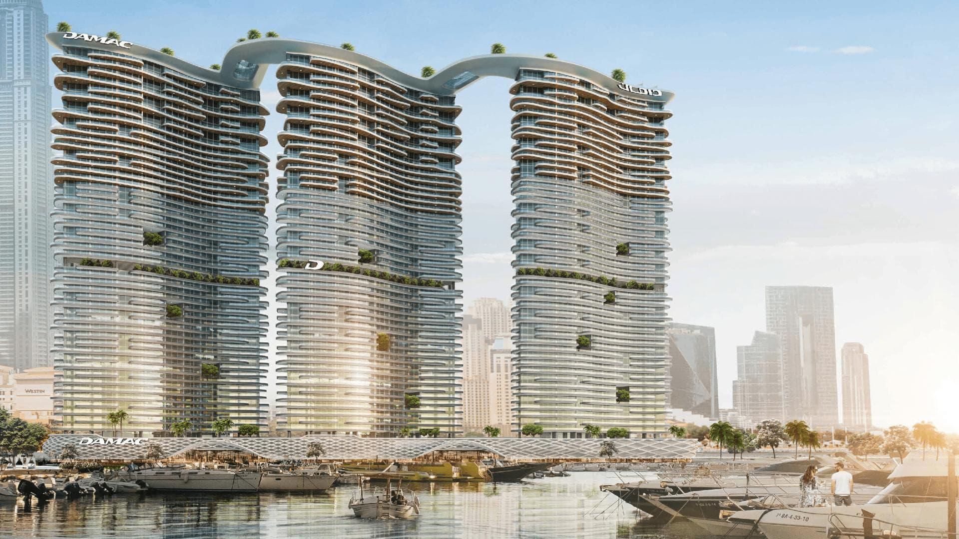 Luxury Damac Bay apartment balcony with stunning sea views, pool, and modern design