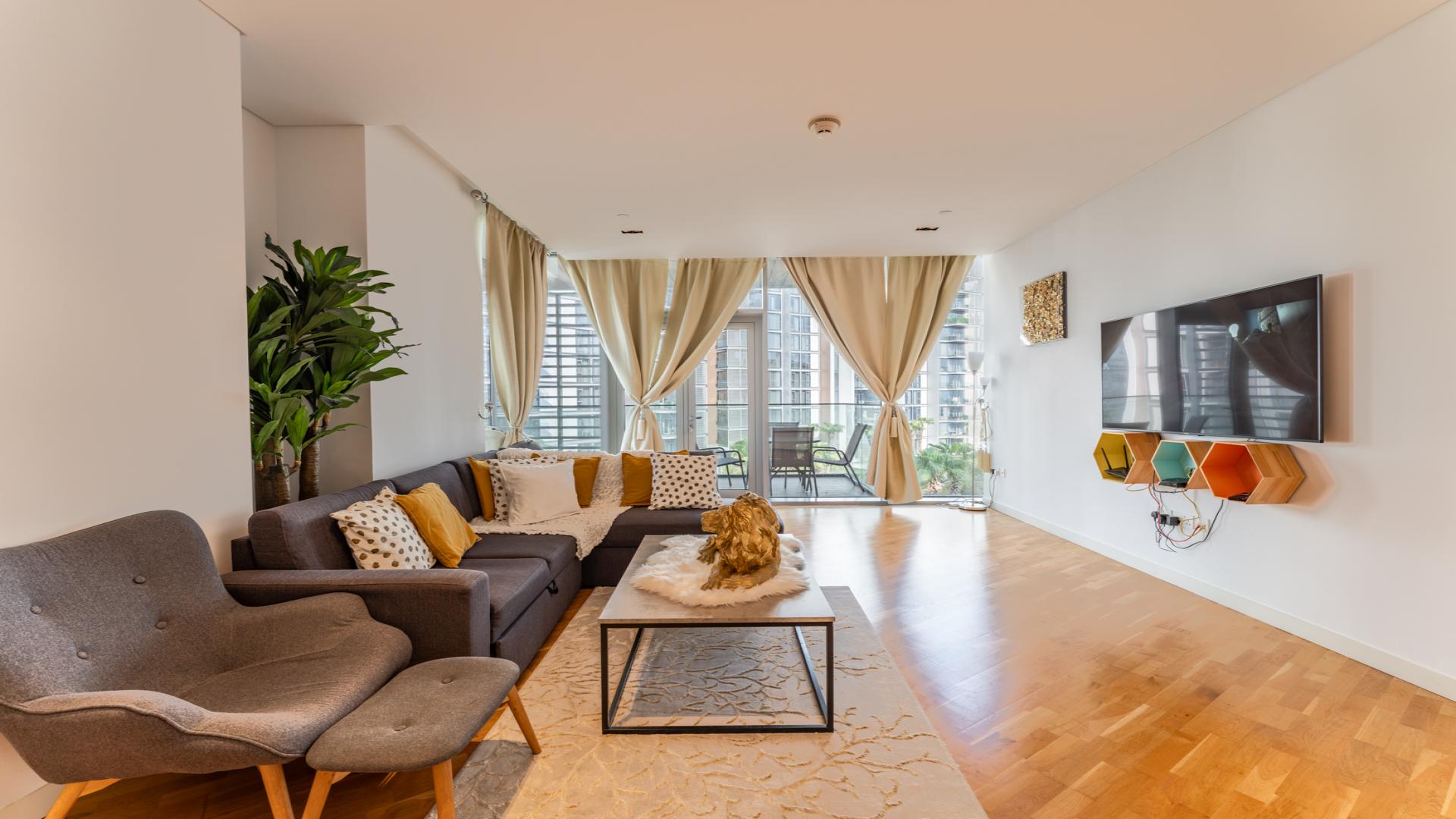 Sea view from Bluewaters Residences apartment balcony, showcasing modern architecture and lush surroundings