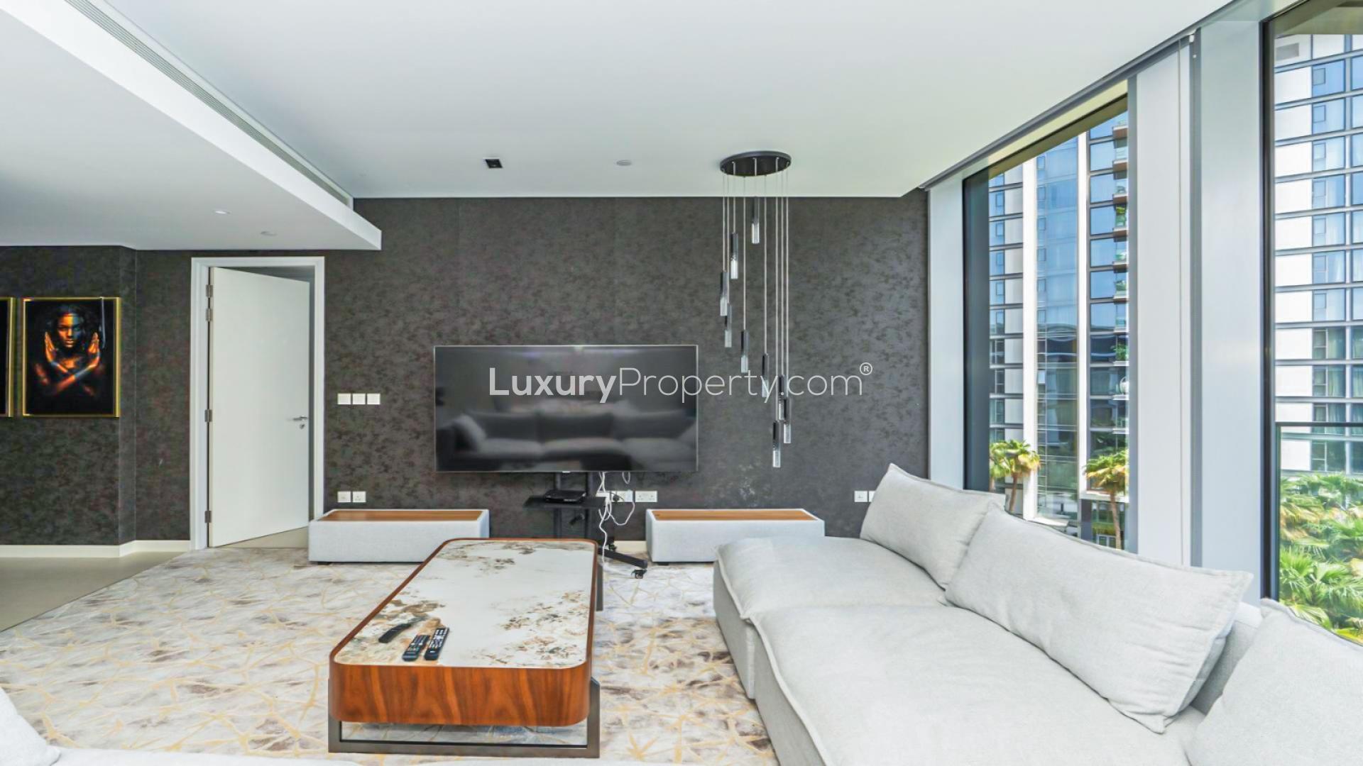 "Modern Bluewater Residences apartment with sea view, pool, and city skyline, Ref LP49123.",Living room with modern decor in Bluewater Residences' 1-bedroom apartment for sale