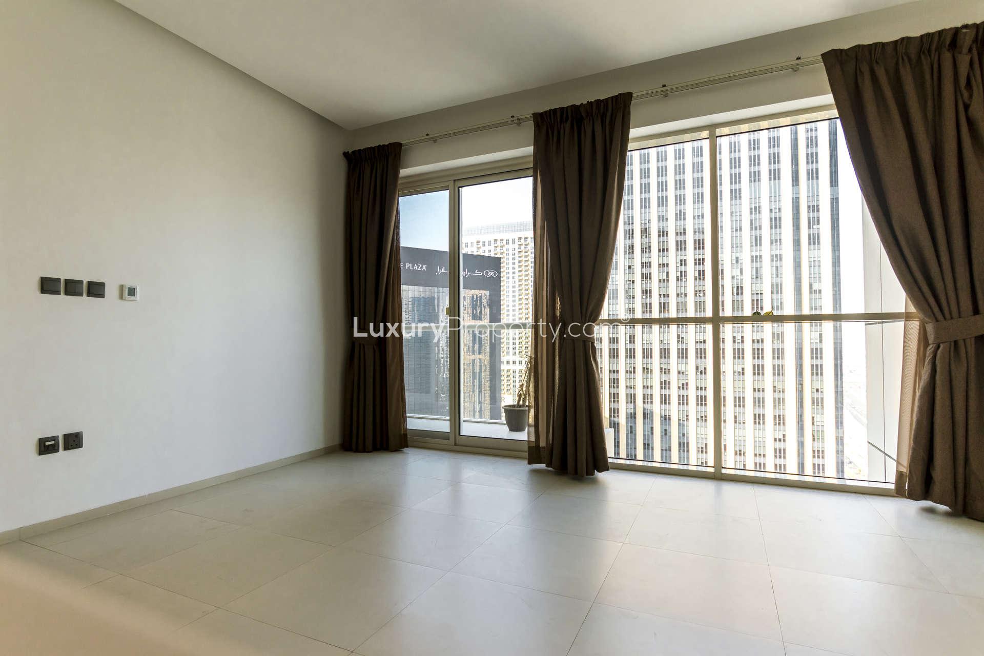 Luxury one-bedroom apartment living room with large windows, Dubai Marina view, West Avenue