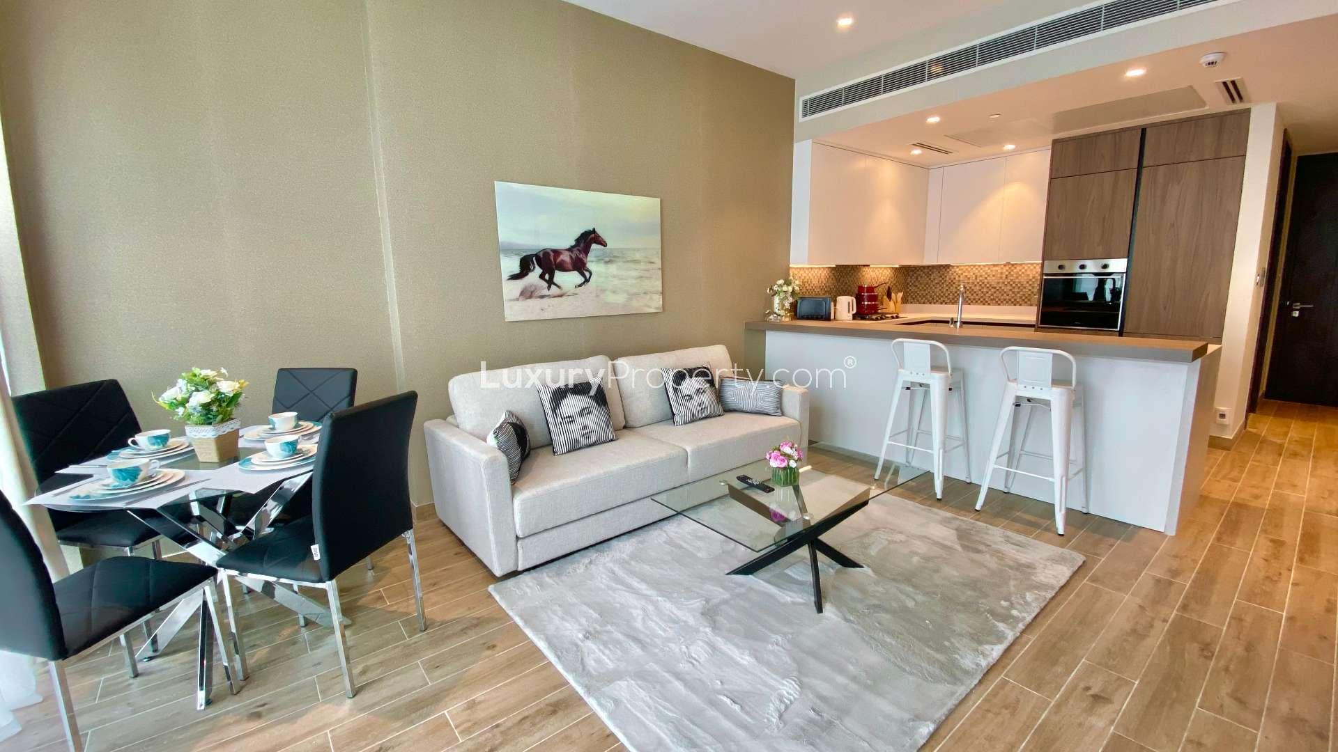 High-floor Dubai Marina Gate apartment kitchen and dining area with modern design