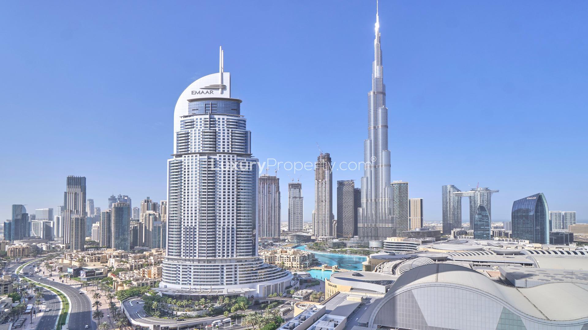 Furnished Downtown Dubai apartment living room with Burj Khalifa view, modern decor, natural light