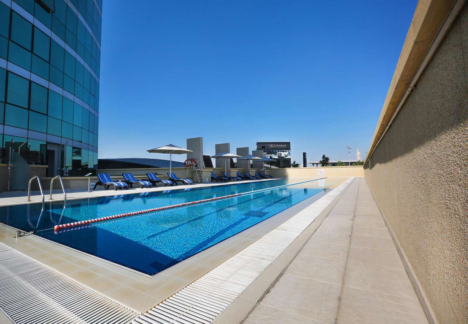 Modern living room in Marsa Plaza apartment, Dubai Festival City, with large windows and decor