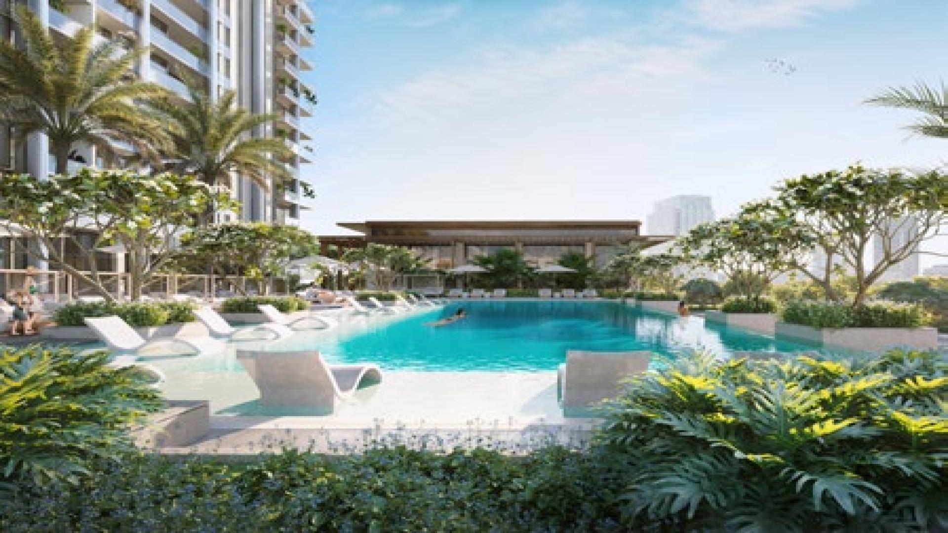 Outdoor lounge and garden area at The Highbury apartment in MBR City, for sale