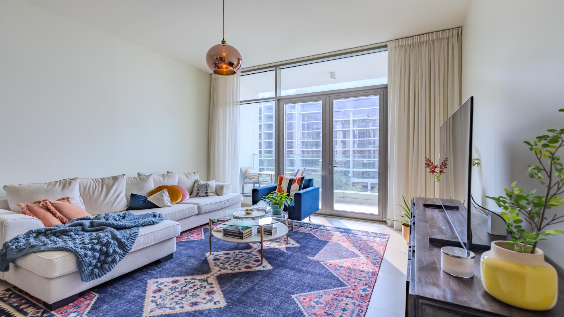 Modern living room in Dubai Hills Estate apartment, featuring elegant decor and natural light