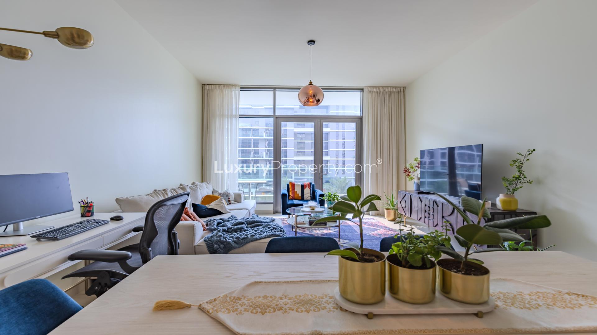 Modern living room in Dubai Hills Estate apartment, featuring stylish decor and large windows