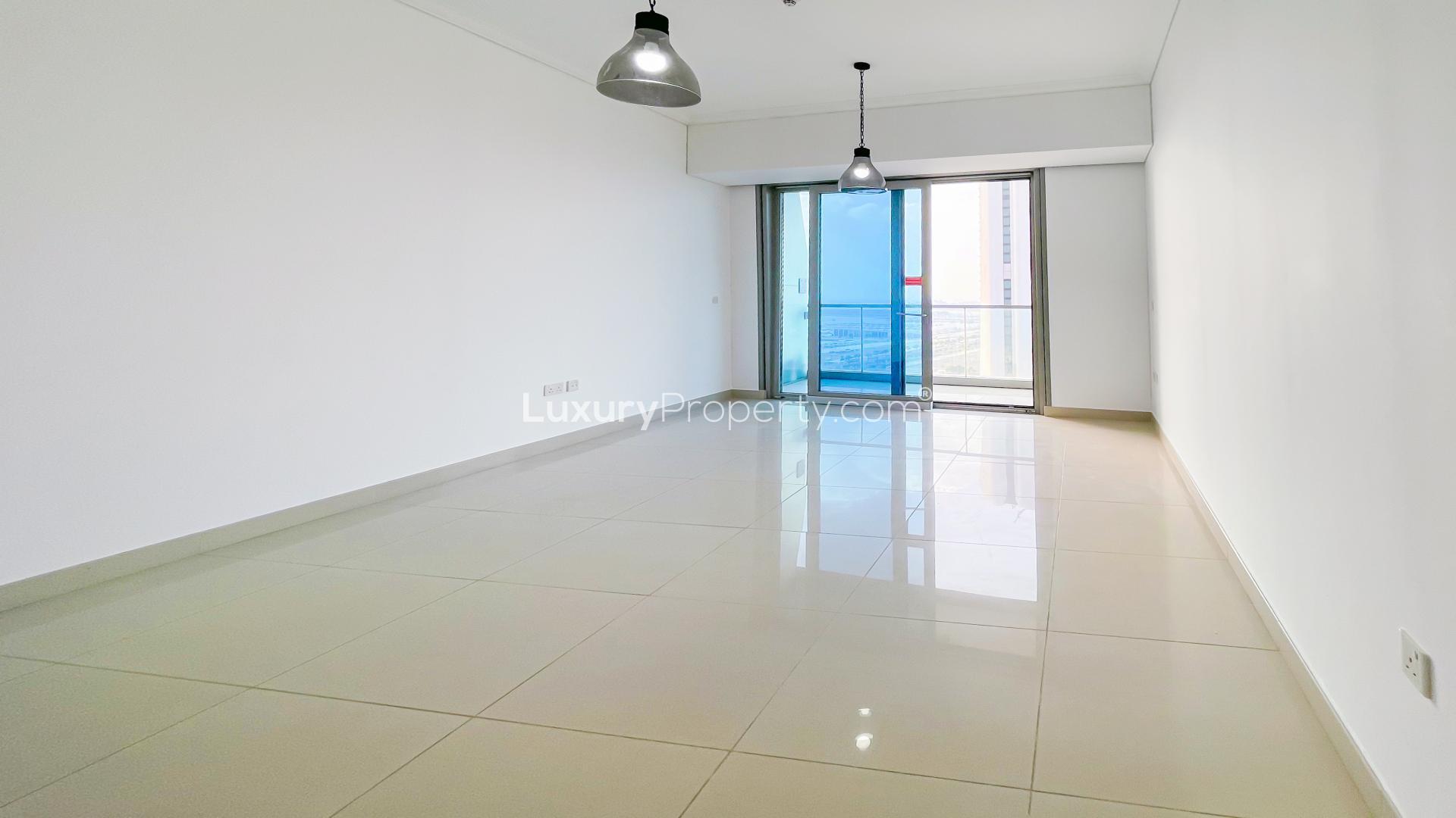 "Spacious balcony view from modern Ocean Heights apartment in Dubai Marina for rent.",Modern living room in Ocean Heights apartment, Dubai Marina, with large windows and tiled floors