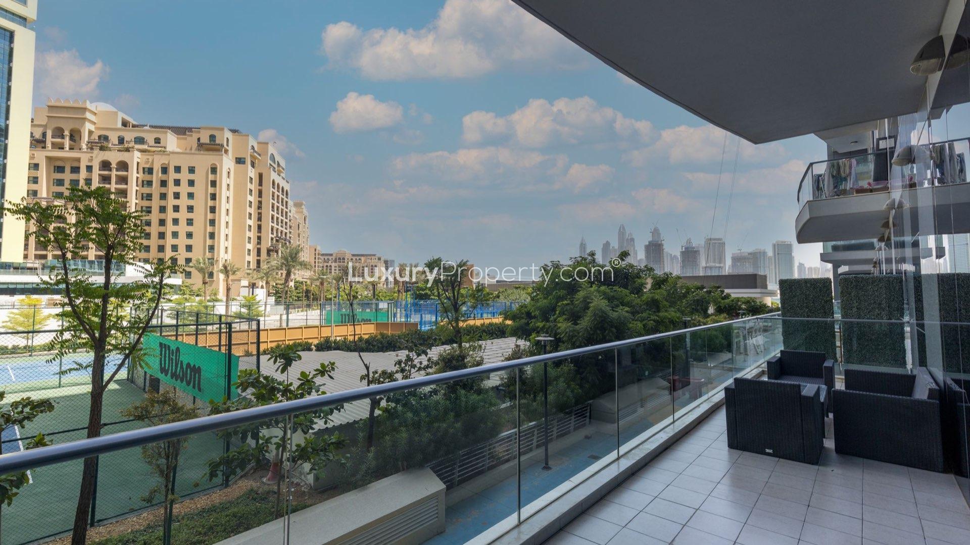 Luxurious bedroom in Palm Jumeirah apartment with elegant four-poster bed and cozy decor