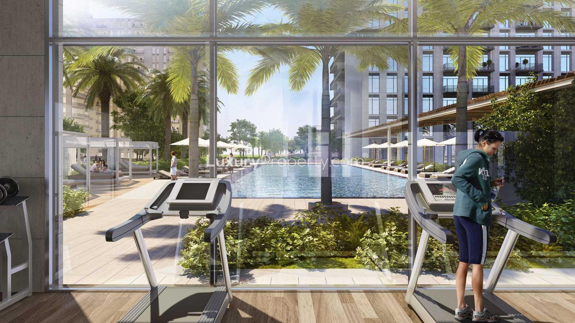 Luxurious bedroom in Park Heights apartment, Dubai Hills Estate, featuring modern decor and balcony view