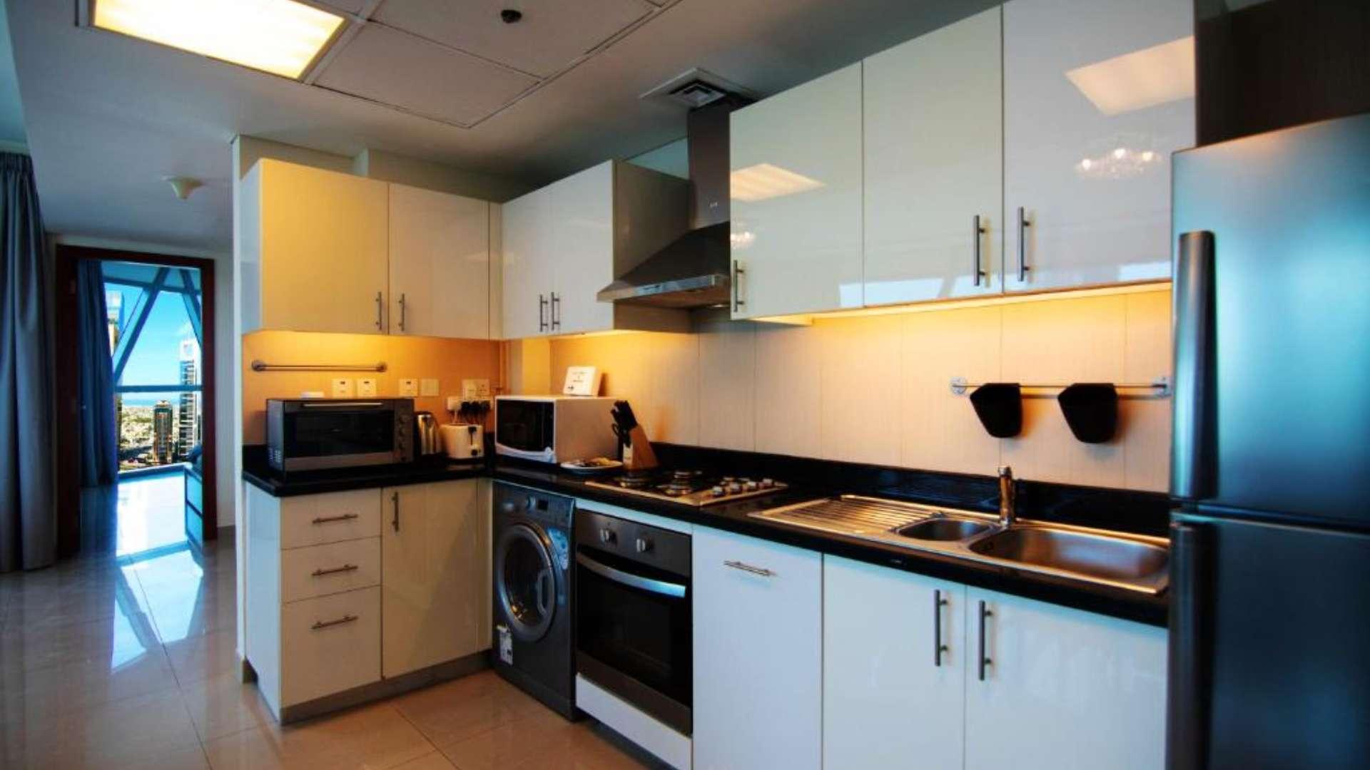 Spacious DIFC Park Towers apartment with Zabeel view, featuring large windows and elegant decor