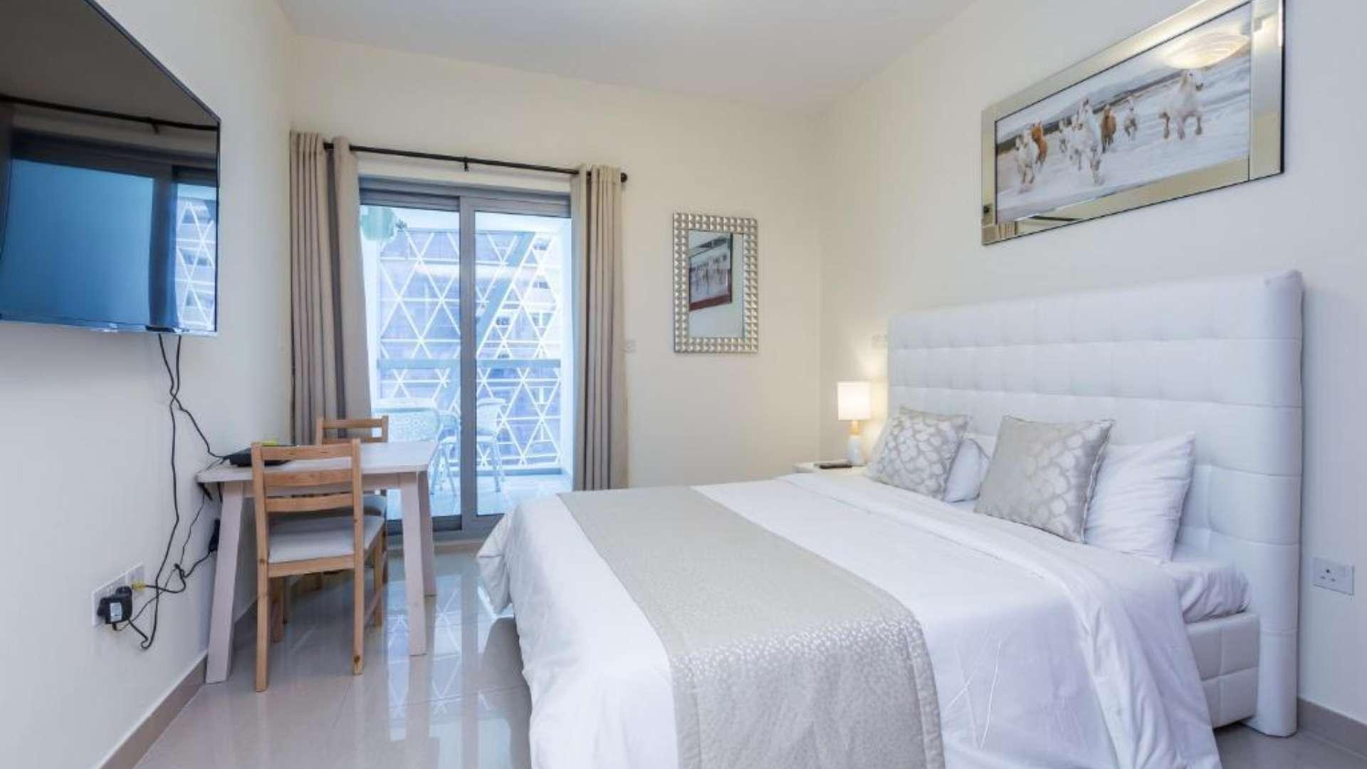 Spacious DIFC Park Towers apartment interior with large windows and decorative wall design