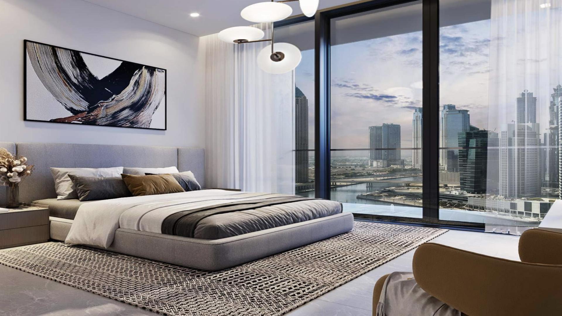 Luxurious poolside view at Peninsula Four apartment in Business Bay, Dubai