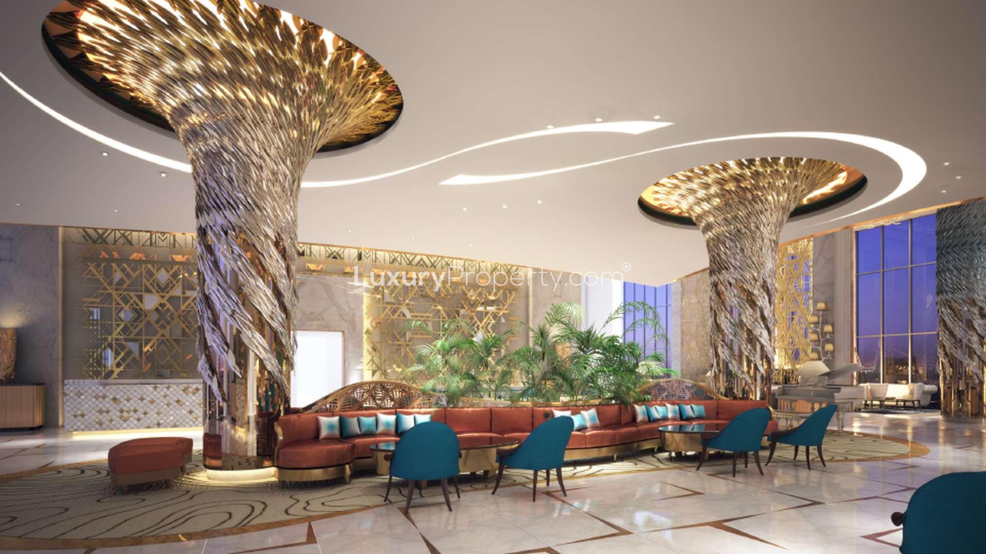 DAMAC Maison Privé towers at night in Business Bay, Dubai skyline backdrop