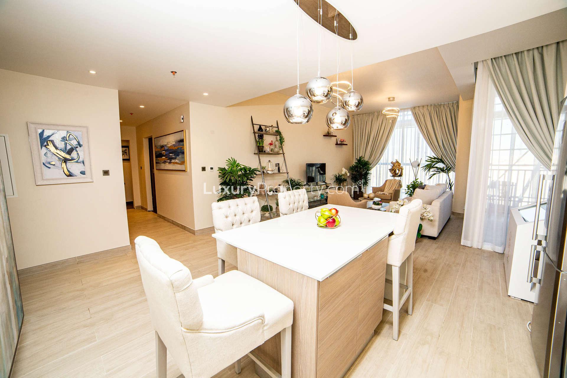 Modern open-plan kitchen and living area in Q Gardens 1-bedroom apartment, Arjan