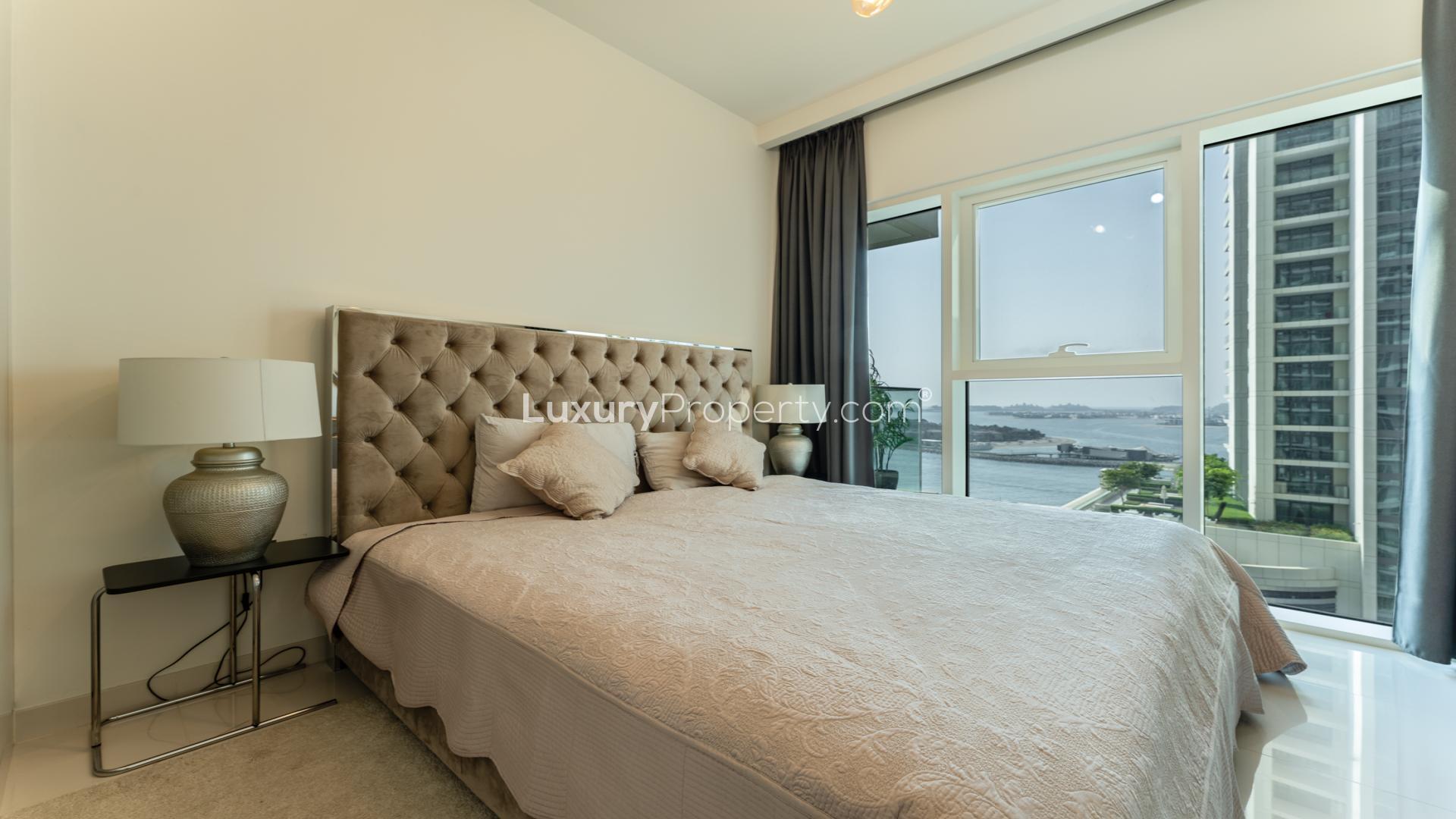 "Stunning Palm Jumeirah views from 1-bedroom apartment in Sunrise Bay, Emaar Beachfront, Dubai Harbour.",Bright bedroom with Palm Jumeirah view in Sunrise Bay, Emaar Beachfront, Dubai Harbour apartment