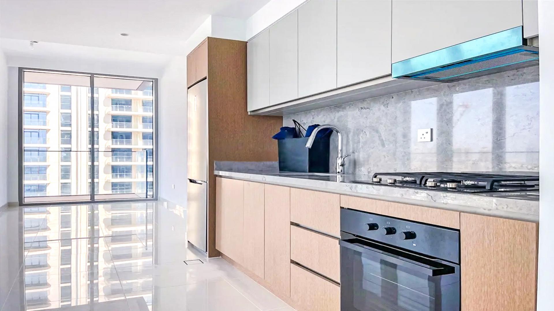Spacious modern kitchen in elegant Emaar Beachfront apartment, Dubai Harbour, with sea view