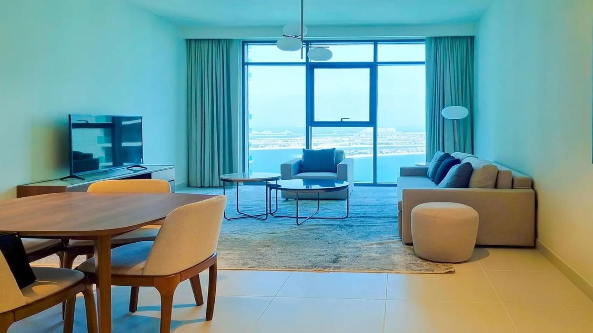 Rooftop infinity pool with stunning Dubai Harbour and skyline views at Emaar Beachfront apartment