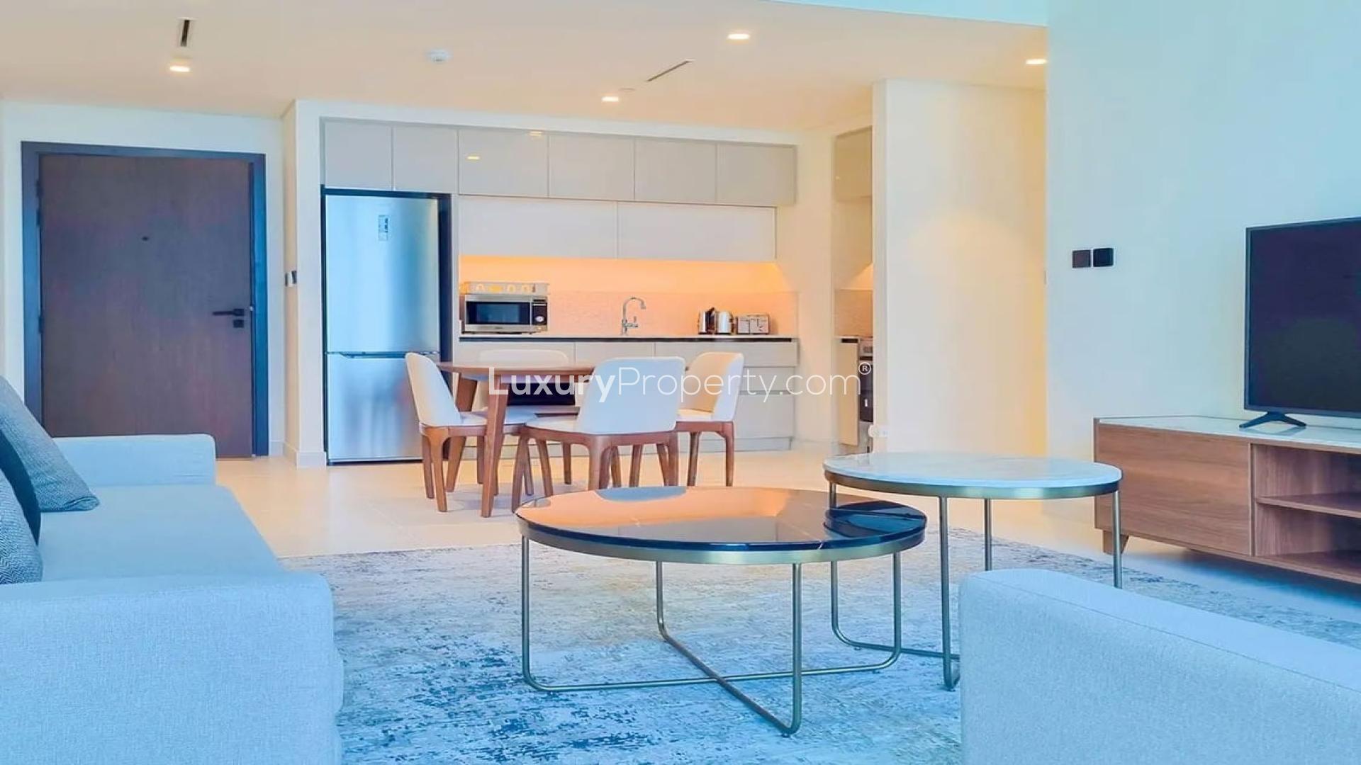 Rooftop infinity pool with stunning Dubai Harbour and skyline views at Emaar Beachfront apartment