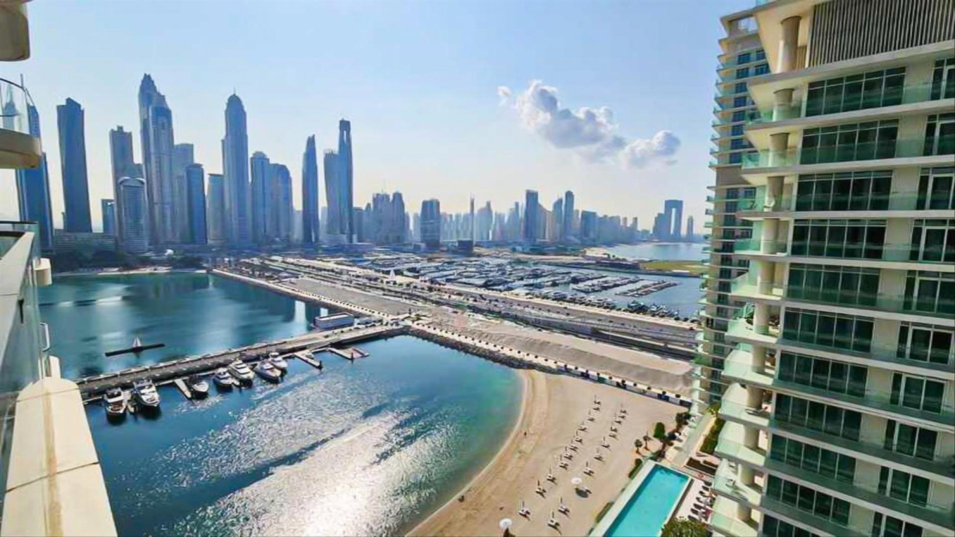 Stylish living room in Emaar Beachfront apartment, Dubai Harbour, with sleek furniture and sea views