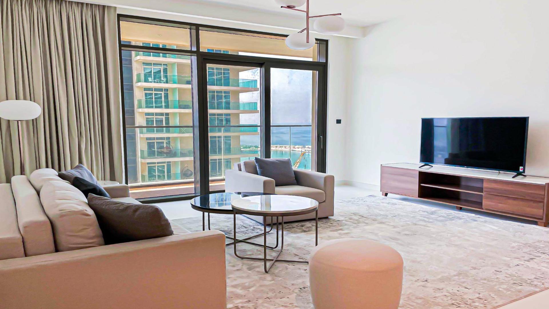 Aerial view of Dubai Harbour skyline and marina from Emaar Beachfront apartment balcony