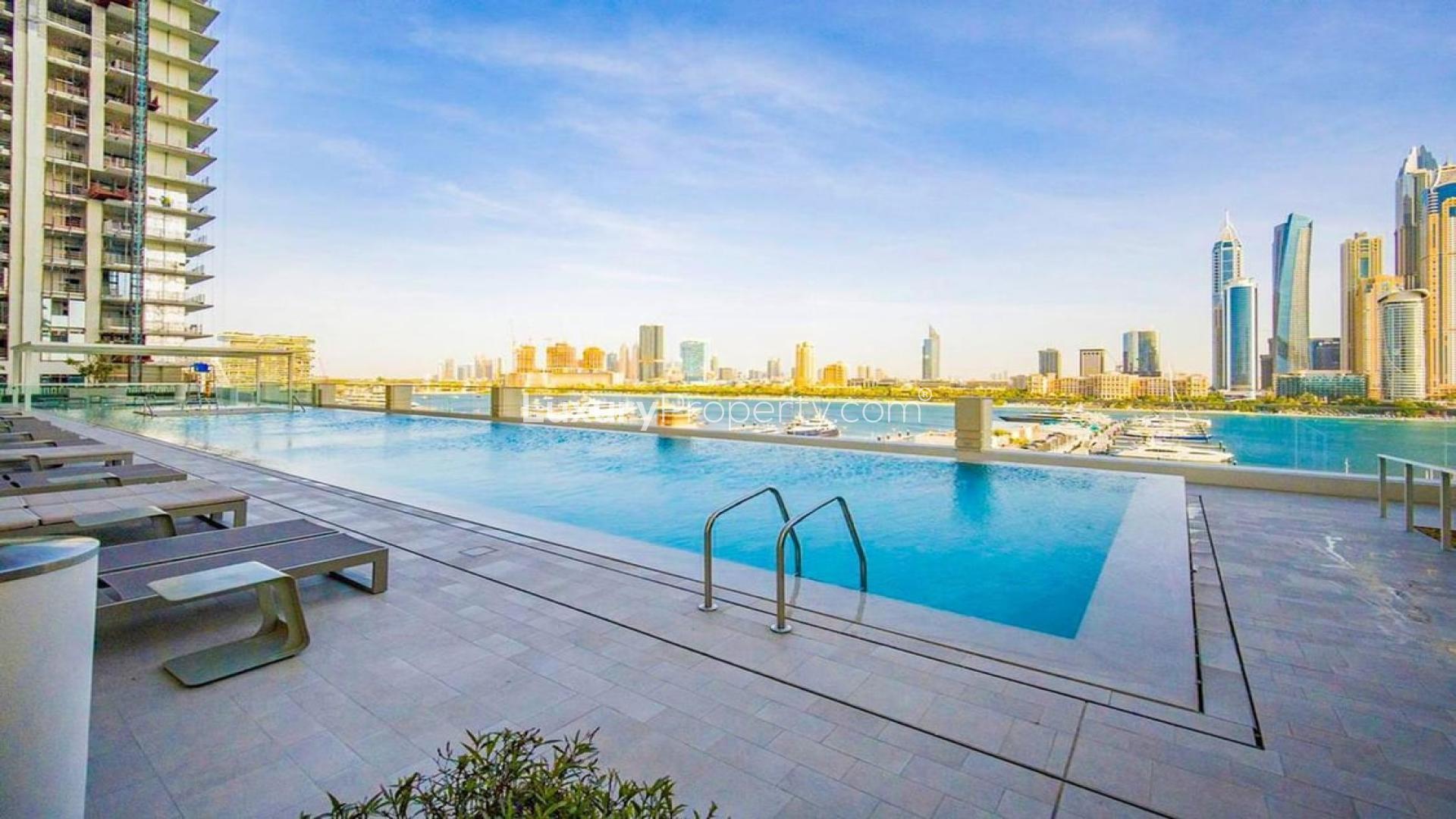 Modern living room in elegant Emaar Beachfront apartment, Dubai Harbour, with stylish furnishings