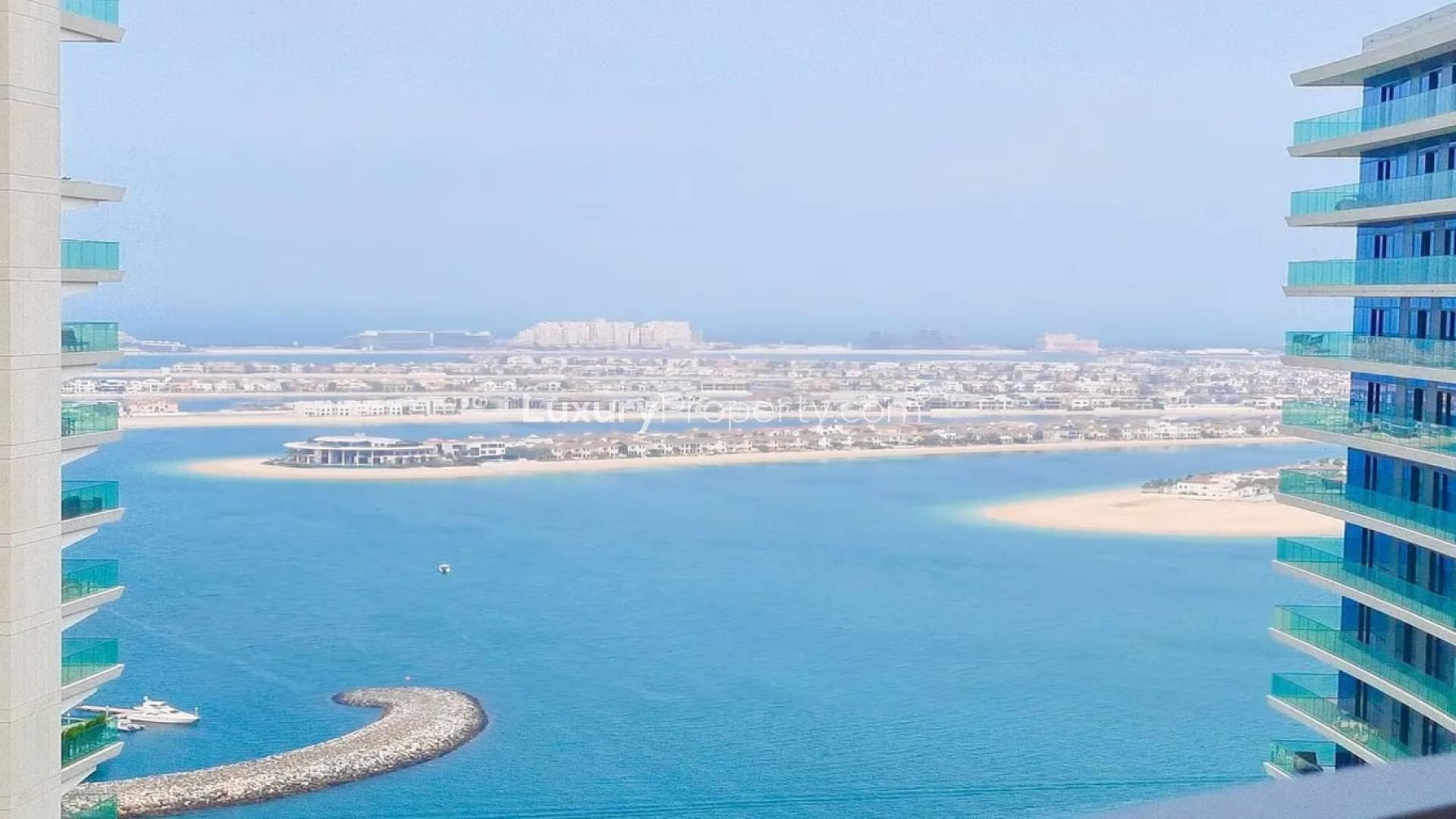 Infinity pool with stunning Palm Jumeirah views at Emaar Beachfront, Dubai Harbour apartment