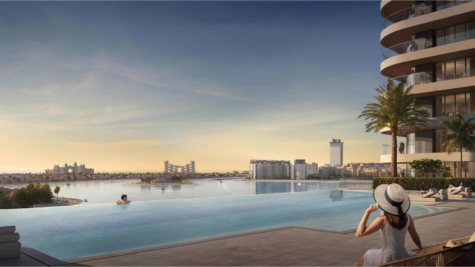 Luxurious rooftop pool with stunning Dubai Harbour views at Emaar Beachfront apartment